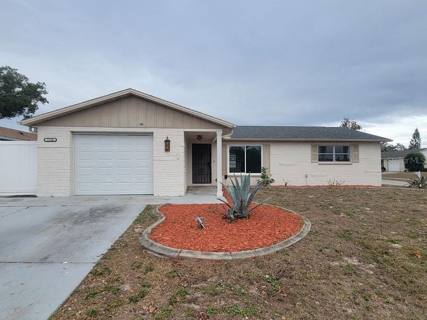 Updated & Spacious 3 Bedroom/2 Bath Home on a Corner Lot!

Welcome to this beautifully updated Port Richey home featuring plank tile flooring throughout—no carpet anywhere! Enjoy an open layout with a separate dining area and an updated kitchen complete with granite countertops, matching countersplash, stainless steel appliances, and a pantry. Both bathrooms have been tastefully updated for a fresh, modern feel.

Step outside to a large, fenced-in backyard with white PVC fencing and a storage shed, plus a screened-in back porch perfect for relaxing. The home also offers a one-car garage with washer and dryer hookups.

Move-in ready and situated on a spacious corner lot—don’t miss this one!

The remaining crank windows will be getting replaced!

Dog friendly- breed restrictions apply. No cats!
