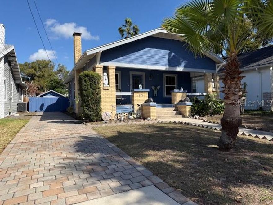 At first this 1927 bungalow, located in one of the most sought after neighborhoods of Old Seminole Heights, seems to have a familiar floor plan, however the attention to detail and the effort to retain the timeless character of this bungalow, is what sets it apart from the others.  
The 96 foot paver driveway welcomes you in and leads you to a cozy front porch with ceiling fans, lighting, and a two person swing, which makes this space comfortable all year round. The original wood floors and moldings have been exquisitely brought back to their former glory and invite you into this spacious floor plan.  First greeted by a working fireplace, only to be escorted to the living room and then, the open air kitchen with granite countertops, stainless steel appliances, under counter microwave,  instant hot water, and garbage disposal.  As well as thoughtfully placed under counter and above sink lighting. Renovations in 2016 included a new roof, new central air conditioning and heating, new electrical housing three-way switches throughout the home, as well as electrical outlets in the front and back porches and back yard.  Also a new plumbing system with amazing water pressure, and a tankless electric hot water heater.  Both bathrooms have granite countertops and detailed tile work.  The guest bathroom offers dual sinks and the original bathtub, which is large enough to house your pet gator.  The primary bathroom houses the original medicine cabinet and has a granite topped bench in the shower.  All three bedrooms have ceiling fans and are oversized, the primary has a walk in closet and a door that leads to the screened in porch.  Stepping into this beautifully designed 140 square foot screened in porch is when you discover the tranquil oasis of this extremely private backyard.  Fully fenced in with a custom designed paver patio, as well as a shed that can be used for anything from storage to a workshop or a garage.  Ideally located just a short walk from Epps Park, the Hillsborough River, and Henry & Ola Park, this home delivers both tranquility and access to some of Seminole Heights’ most desirable natural amenities.  As well as, within walking distance to the thriving eateries along North Florida Avenue.  The home has custom made snap on hurricane shades for added peace of mind.