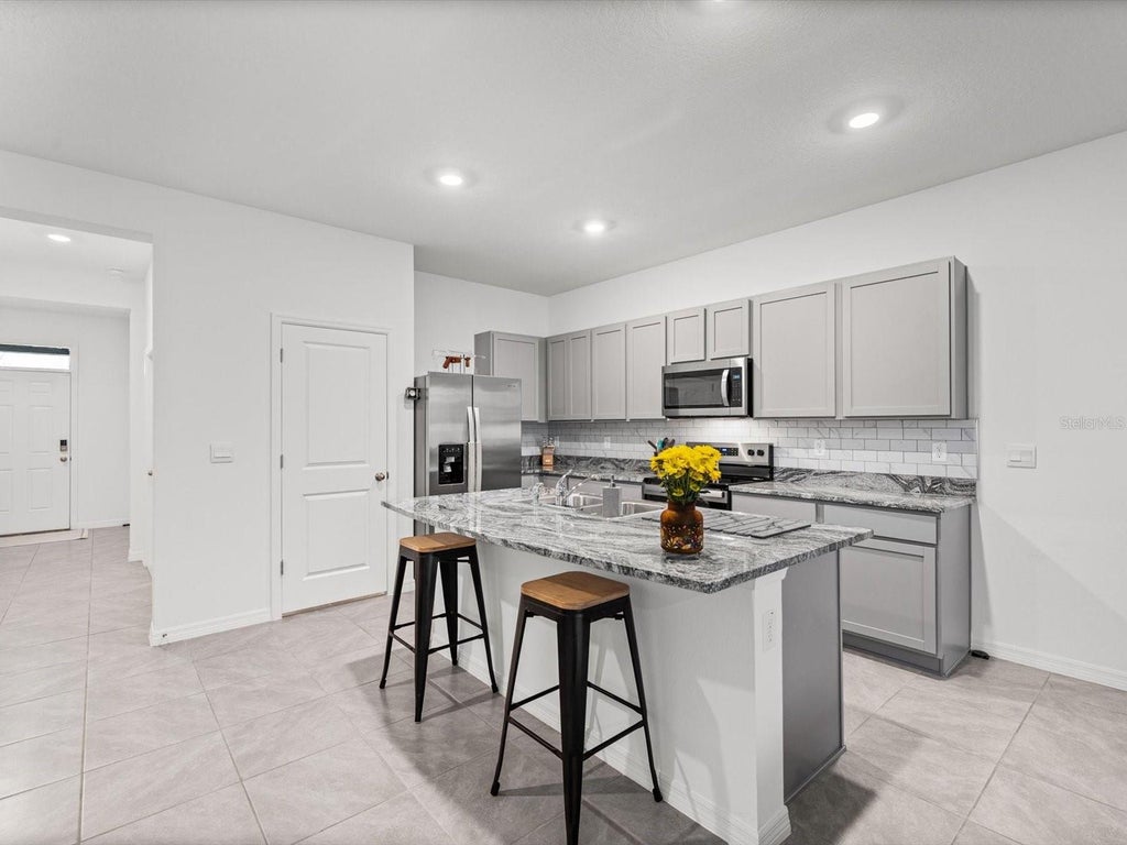 Photo of 16630 Grotto Steam Place, Wimauma, FL 33598 (MLS # TB8550531)