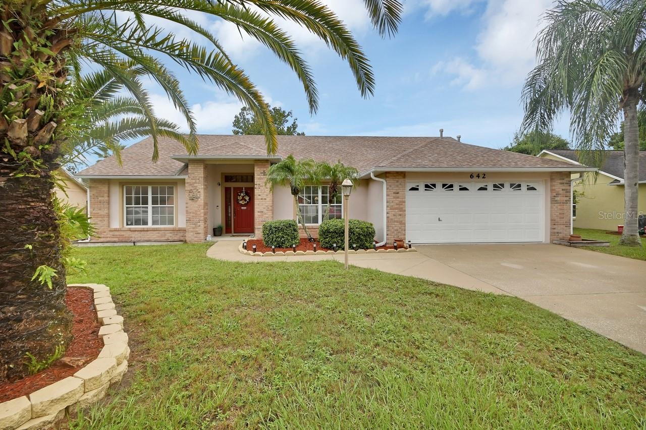 This charming 3 bedroom, 2 bath home is in the quaint Eastbrook community just 1 mile from downtown DeLand and Stetson University. The welcoming brick front sets a cozy and inviting tone. Inside, you will find an open floor plan that offers flexible living, including a versatile bonus room that can serve as a formal dining room, office, study or add a set of doors and you have a 4th bedroom. The great room and bonus room feature laminate flooring, while the kitchen, bathrooms, and laundry room have ceramic tiles.
The spacious owner’s suite has a walk-in closet, and an updated bathroom complete with a garden tub, separate shower, and dual sink vanity. The great room opens to a 10 x 21 enclosed porch, perfect for relaxing or entertaining, overlooking a fully fenced backyard that provides both privacy and comfort.
Eastbrook has natural gas, offering energy-efficient appliances for modern convenience. There is a Maytag Water Filtration System, 2017 Roof, 2018 Trane AC System, 2019 Gas Water Heater, 2022 Exterior Painting, 2023 New Refrigerator, 2024 4 New Windows.
Living in DeLand means being part of a vibrant, welcoming community rich in history and alive with arts and culture. DeLand is a charming downtown, where brick-lined streets invite you to browse unique shops, dine at locally owned restaurants, and explore the bustling farmer’s market. Just moments away, Stetson University infuses the area with youthful energy and cultural events.
Nature lovers will appreciate nearby Lake Beresford Park and Hontoon Island State Park, De Leon Springs State Park, Blue Springs State Park, offering endless opportunities for hiking, kayaking, and wildlife watching. For travelers, the location is unbeatable—easy access to I-4 connects you to Orlando, Daytona Beach, and beyond, while the DeLand Amtrak station makes regional travel. Sun Rail is available from DeLand and DeBary.
Discover the charm, convenience, and community spirit that make DeLand one of Florida’s hidden gems perfect blends of small-town living with big-city access.