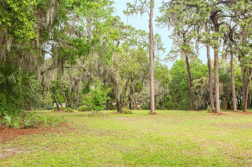 MASSIVE PRICE REDUCTION! Build the FAMILY COMPOUND you have always envisioned or develop for several families. The options are endless!! Are you already in Tampa Bay and have been searching for a large centrally located parcel? With all the growth in Tampa Bay, this 9.8 acre Carrollwood estate property with a bonus house is a hidden gem. This property has stunning views of two lakes and has generous lake frontage for building your own dock. This home and estate property come with a piece of storied Tampa history that harkens back to many prominent names and builders of Tampa Bay's history. Dating back to 1914, this estate has a history in building Tampa Bay, and now it is time for new history to be written! As you enter this ecologically diverse property through the gate you will drive down a long driveway to the back of the property where the original home was built. The back of the property sits on Boat Lake, also known as “Boot Lake” because of its unique shape and is 34 1/2 acres of pristine nature. To the left is Carroll Cove Lake at 5.14 acres, which is the inlet to Lake Carroll, over 210 acres. This property features direct/private access to both lakes. (Boaters heaven). The wildlife is abundant and diverse; you feel like you are tucked away in a nature preserve in the heart of bustling and growing Tampa. This pristine property is an ideal shape for building a new home or remodeling and re-imagining the current one on the secluded back portion. Maybe the main home plus a guest house, gym, or pool house on the front part? The only thing holding you back is your imagination. The house on the property was built in 1957 and has everything you need to keep you comfortable while building your Florida forever home. The house will need some work and no value is being assigned to the house and property is being sold as land value. The property can be divided into several separate lots, which would allow you to build the family compound you have always desired. This is truly your own slice of paradise that can be built to satisfy generations of your family old, young and present. Value is in the land, house on property listed as residential as well. Conveniently located 20 minutes away from Sparkman Wharf, 15 minutes to Avila Golf and Country Club, 20 minutes to Amalie Arena, 20 minutes to Curtis Hixon Waterfront Park. Other Tampa gems include Tampa international airport at 20 minutes, Raymond James Stadium 20 minutes, midtown Tampa 18 minutes, Carrollwood Country Club 18 minutes, and Moffitt Cancer Center 18 minutes.