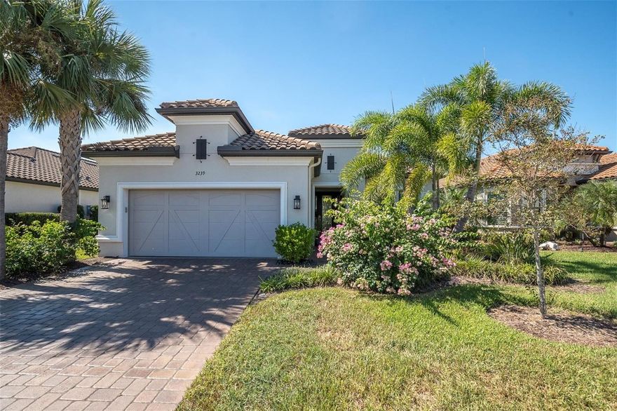 UPGRADED TAYLOR MORRISON LAZIO, WITH CUSTOM DESIGNED OUTDOOR KITCHEN ON A PREMIUM POND LOT. Turnkey Taylor Morrison Lazio spanning 2368 sqft on one story offers 3brs, 3 ba + office w/ 3 car Tandem garage, on a private POND lot in the gated Esplanade at Starkey Ranch. Spending time relaxing in your screened Lanai, overlooking the peaceful pond and grilling in the custom outdoor kitchen and dining in the evening hours makes the end of any day a pleasure or having a beautiful breakfast makes the beginning of each day have positive affects on the day. This home boast over $155K in builder upgrades & $100K after market upgrades in this pristine home offers noteworthy upgrades including 8-ft doors, 10' Ceilings, Level 4 Porcelain tile in main living areas + office, wood look laminate in Owners suite and additional FLEX room, crown molding, freshly painted exterior w/Sherwin Williams Fresh Rain Essence paint in 2023. Inviting Mediterranean elevation, barrel tile roof, lush landscaping w/ lighting & paver driveway + walkway. Front door w/ etched glass & sidelights greets guests. Setting the tone is a tray ceiling w/ statement chandelier for the level of upgrades within.  To the right of the entry foyer is a full bath w/ tub shower combo & adjacent 2nd Bedroom (currenly used as an office)  Porcelain tile floors, ceiling fan, double 8' door closet open up to additional space for storing items and 2 windows.  The 3rd bedroom w/ an ensuite full bath featuring upgraded after market granite, full seamless glass shower enclosure will impress any guest that might grace your beautiful home. The main gathering area as the floor plan unfolds feature a One of a Kind, custom designed entertainment wall, with Venitian Plaster finish, glass shelving for your collectibles and glass designer enclosed cabinetry, for add'l items. This wall features a built in electric heated fireplace, large area for TV (currently 77" it could be a bigger one), can lights, ceiling fan, Crown molding, flooded by natural light & a view of the pond, makes it just about perfect. The designer GOURMET kitchen will impress w/abundance of 42’ solid wood Level 5 Creme w/Chocolate Glaze Cabinets with upgraded hardware, lightrail, crown, designer Backsplash, SS Apron Sink w/hands free faucet, upgraded SS appliances, built in Microwave & Oven, Dishwasher, Café Range Gas cooktop, designer Hood , Wine Frig. Walk in pantry offers addtl storage. Massive Island illuminated by 2 pendant lights will be a place to gather & entertain inclds seating for 4. Owners suite is complimented by 3 windows frame the pond, motorized shade & fan. Spa-like Master Ensuite includes fine details like his & hers sink w/ Granite counters, cabinet & drawers, oversized car-wash shower, spacious walk-in closet, w/built in-organizer. Watch the awesome sunsets from your extended, covered lanai overlooking the pond. The luxurious outdoor kitchen features Broil King Grill, dine rain or shine under covered, shaded lanai.  Laundry room has built-in cabinetry w/sink. Plantation shutters through out. Fresh air intake & electronic filter to A/C. Enjoy a maintenance-free lifestyle at Esplanade featuring, fitness center, Resort Style & Resistance Pool, Tennis Courts, Pickleball Courts, dog Park, Playground & social activities. Lawn & weed care included. Zoned for Magnet Starkey K8. Close to Restaurants, shopping, Golf Courses, Beaches & Tampa Airport. Enjoy an lifestyle everyone deserves in this custom designed and maintained home!