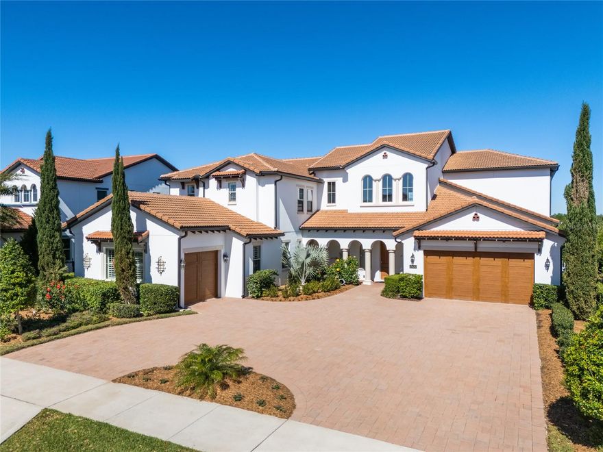 Welcome to this extraordinary luxury home, offering direct lake access on Lake Panther, nestled within the Lakeshore Preserve community in Winter Garden. This 6,000+ sq. ft. residence offers 5 bedrooms, 5.5 bathrooms, an executive office, and a spacious bonus room, all with breathtaking views of Panther Lake. Completely reimagined by the current owner, this home showcases unparalleled craftsmanship and modern elegance. Hundreds of thousands invested in recent updates include engineered hardwood flooring, a completely redesigned kitchen, and a fully reimagined spa-like primary bathroom. Additional updates include another renovated full bathroom and a remodeled downstairs half bath, custom ceiling beams, built-in shelving, accent walls, an electric fireplace, a new built-in grill for the summer kitchen, a redone staircase, laundry room, and butler’s pantry. The modern Mediterranean architecture is enhanced by a circular driveway with dual access points. Step inside to soaring ceilings and immediate, unobstructed lake views. The gourmet kitchen features an oversized quartz island, a large farmhouse sink, and high-end Viking appliances, including an eight-burner natural gas cooktop with dual gas ovens. The kitchen also has an additional built-in electric oven and microwave, new cabinetry, and a Liebherr wine fridge for fine wine storage. The butler’s pantry and walk-in pantry are conveniently located just off the kitchen. The space flows seamlessly into the sitting and family rooms, where expansive lake views and elegant ceiling beams create a stunning focal point. On the west wing of the home, you’ll find an executive office, an updated laundry room, and a large guest suite with its own private garage entrance, making it an ideal in-law suite. The primary suite is also located in this wing, offering private pool access and breathtaking lake views, along with two walk-in closets. The fully remodeled primary bathroom has been transformed into a true spa-like escape, featuring an oversized shower, a soaking garden tub, and high-end finishes. Step outside to experience Florida lakefront living. The outdoor lanai features retractable screens, a heated pool and spa with a waterfall feature, and a summer kitchen with a brand-new built-in grill, creating an ideal space for outdoor cooking and entertaining. The elegant updated open staircase leads you upstairs, where the home continues to impress with a large bedroom featuring an ensuite bathroom and two closets making this an ideal second primary suite. Two additional bedrooms provide comfort and privacy for family and guests. The open loft leads to a screened balcony overlooking Panther Lake. A massive bonus room, currently used as a game room and a TV room, provides endless possibilities. The home features three garage spaces (a two-car and a one-car garage), three AC units, and two tankless Rinnai water heaters. The HOA includes lawn care and access to the amenities, all located on Panther Lake. These include a resort-style zero entry pool, playground, clubhouse, fitness center, firepit, beach volleyball court, a dock on the lake, and a kayak launch. The home is minutes from major highways, Orange County National Golf Center, and Hamlin Town Center, featuring shopping, dining, and entertainment, with Disney World also just minutes away. This luxury home offers breathtaking views, meticulous updates, and the perfect blend of comfort and elegance. Schedule your private tour today.