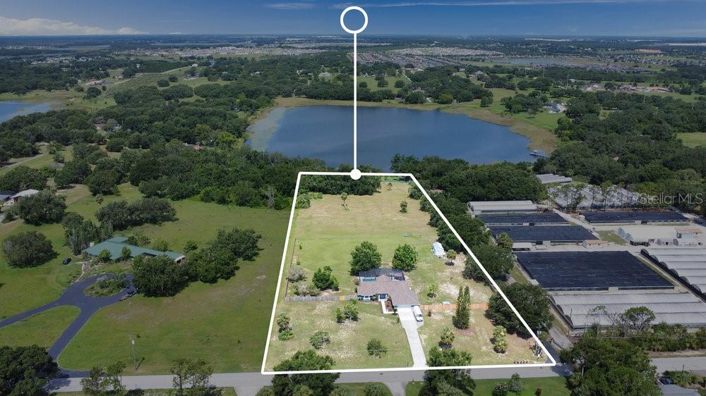 One or more photo(s) has been virtually staged. Discover your dream home in the heart of Minneola! Priced just below recent appraised value. Seller is offering a 10k in closing costs or a interest rate buydown for the buyer. This stunning property at 17927 E. Apshawa Rd. offers the perfect blend of modern comfort and serene surroundings. Nestled on a peaceful backroad, this completely updated home (see attached update list) boasts a spacious 4 bedrooms, 3 bathrooms (includes detached apartment with 1 bed/1 bath/kitchenette), open concept living area, updated kitchen with black stainless steel appliances, a beautiful pool on 5+ acres with additional shared access to recreation and a dock on the private lake. With 1,719 sq ft of beautifully designed living space, this home is ideal for families, entertainers, or anyone seeking a tranquil escape. The property features a large pool that was installed with a salt filtration and waterfall in 2020, a large deck for entertaining with a screened enclosure, there are tile floors and vaulted ceilings throughout, new light fixtures and paint, walk-in closets in all the bedrooms with ample storage, the kitchen has soft closed cabinets with crown molding, under cabinet lighting and Quartz countertops and the Primary bathroom has a spa-like feel with walk-in shower, oversized tub, dual sinks and door leading to the pool, and is move-in ready for your next chapter. Enjoy the sunsets and sandhill cranes on this spectacular property. Don’t miss this opportunity to own a slice of paradise in Minneola! Schedule a private tour today and experience the charm of 17927 E. Apshawa Rd for yourself. The Apshawa Groves area is off the beaten path, emphasizing seclusion and natural beauty, which makes it ideal for those seeking a quiet retreat. However, its proximity to Highway 27 and Clermont ensures that urban conveniences are never far away. The combination of lakeside activities, community events, and easy access to shopping, dining, and schools makes this location highly desirable for families, retirees, or anyone looking for a balanced lifestyle. Enjoy the best of Florida living with Outdoor Recreation and Natural Beauty: Lake Minneola (approx. 4-5 miles away), Lake Louisa State Park (approx. 10-13 miles), Minneola Trailhead Park (approx. 4 miles), Downtown Clermont restaurants and Breweries, shopping. Turnpike access at N. Hancock road is less than 10 minutes away. Top rated schools. Hospitals within 10 minutes away. New siding coming for the ADU. https://listing.trevisuality.com/vd/201805846 Shared tract info: https://gis.lakecountyfl.gov/gisweb/?x=408699.7870995533&y=1554352.318006318&l=15&query=2889608