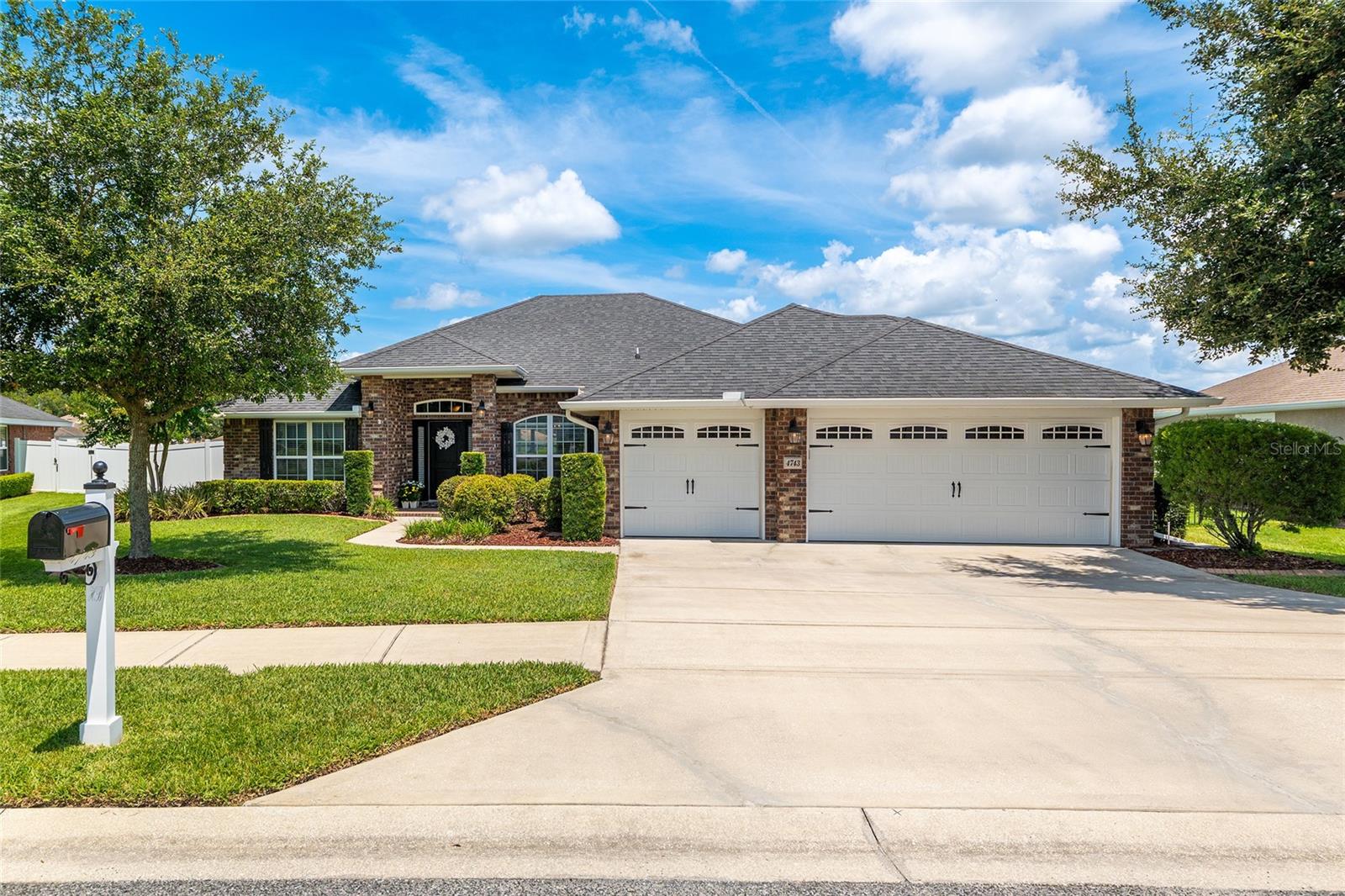 Beautiful 4/3/3 PLUS OFFICE in the popular SW Heathbrook Preserve neighborhood! IMMACULATE & move-in ready! Spacious BRICK home with 2226 ft living space. NO CARPET. Semi-open floor plan with high ceilings, crown molding, LVP flooring, and granite countertops throughout. Office/den/flex room has double doors and can also be a 5th bedroom. Kitchen has breakfast nook with bay window, breakfast bar, newer SS appliances, pantry, and plenty of counters/cabinets. Split bedroom plan. Primary suite has lanai access, tray ceiling, TWO WALK IN CLOSETS, dual vanities, walk in tile shower with bench seat, large linen closet, and water closet. One of the four bedrooms makes a great IN-LAW suite with a private bathroom and possible living room next to it. Inside laundry includes washer/dryer. Screened lanai overlooks vinyl fenced backyard with green space behind (no neighbors directly behind). THREE CAR GARAGE. Home includes gutters and pretty landscaping with curbing. Great school district. Peaceful gated neighborhood is convenient to shopping, dining, medical, entertainment, I-75, and World Equestrian Center! Ride your golf cart to Publix or Market Street at Heathbrook!