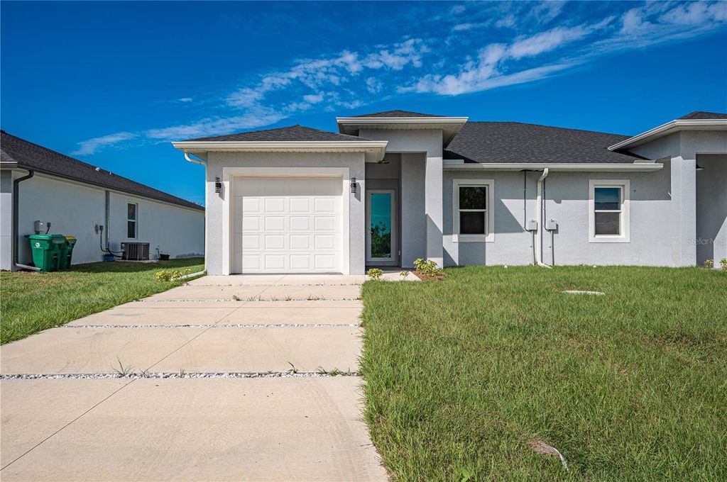 Photo of 8543 Dinnano Street, Port Charlotte, FL 33981 (MLS # O6353136)