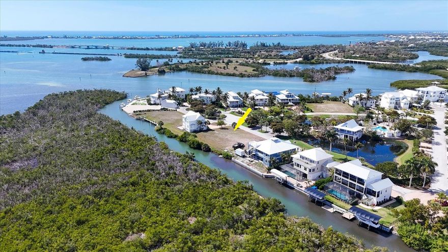 Waterfront lot in the secluded gated community of Anglers Club surrounded by Gasparilla Sound and nature preserves, with direct access to the ICW and Gulf waters! Ownership includes community amenities such as a heated pool, club house, and approximately 1000 feet of community dockage. With 80 ft of direct waterfront and no bridges out to the ICW and Gulf in minutes, you can build a seawall, dock and lift on your very own lot. Call listing agent for details. Located adjacent to Gasparilla Marina with fuel, ships store, service, and a restaurant! Just outside of the gated community is the popular Pioneer biking and walking trail. Build your dream home surrounded by water, natural wildlife, championship golf courses and unbelievable back water and offshore fishing!