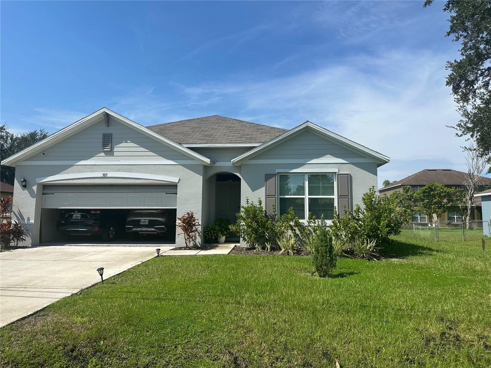Move in ready 2023 built home in the growing community of Poinciana. Step inside to an open-concept layout with abundant natural light and modern finishes throughout. This spacious 4 bedroom 2 bathroom property offers over 1,800 square feet of living space designed for comfort and functionality. The kitchen features sleek cabinetry, solid surface countertops, and stainless steel appliances, seamlessly connecting to a generous living and dining area. The split bedroom floor plan provides privacy, while the primary suite includes a walk-in closet and en suite bath with dual sinks. Outside, enjoy a large backyard on an oversized lot, perfect for entertaining or future enhancements. Conveniently located near parks, schools, and shopping. Don’t miss the opportunity to own a nearly new home at a competitive price in a fast growing area.