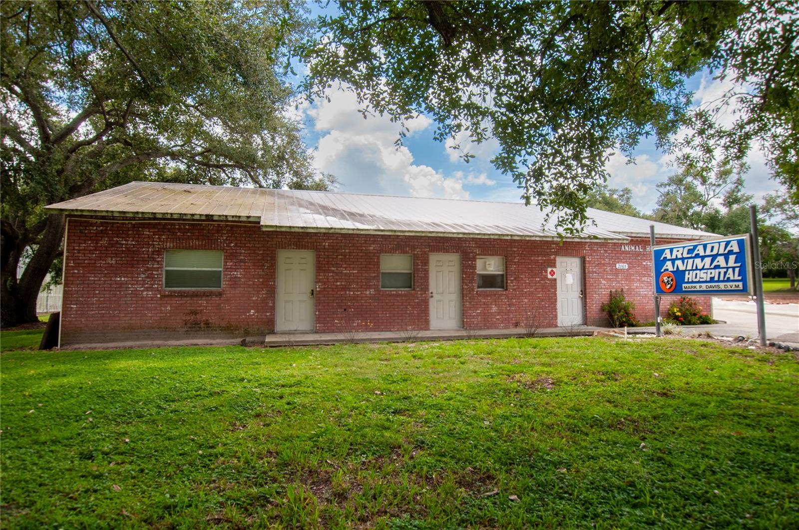 This unique property is currently operating as a veterinarian office and offers an exceptional opportunity for a wide variety of uses. The building features three exam rooms, a welcoming reception area, a private office, and two additional versatile rooms to suit your needs. With four separate entrances, the layout allows for easy access and the possibility of multiple uses or tenants.
Out back, you’ll find stalls along with a dedicated birthing room—perfect for animal care or adaptable for other purposes. With over 1.72+/- acres, there’s plenty of space for growth and expansion.
Situated on a well-traveled road, the property benefits from excellent visibility and high traffic exposure, making it an ideal location for your business. While perfect for continuing as a veterinary practice, it also holds great potential for conversion into other professional or medical offices, offering incredible versatility and investment opportunity.