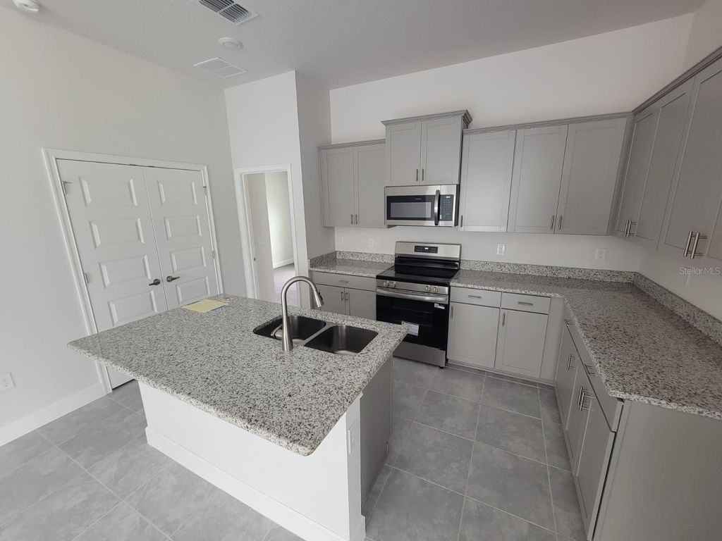 Photo of 2170 NW 23rd Loop, Ocala, FL 34475 (MLS # O6403446)
