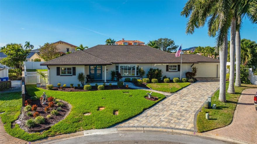 Exceptional pride of ownership is apparent in this move-in-ready, solid block single-level pool home, ideally positioned on a quiet cul-de-sac in the highly desirable neighborhood of Yacht Club Estates. Offering 2,613 heated square feet of thoughtfully designed living space, this home features 4 bedrooms with potential for a 5th, 2.5 baths, interior laundry, and a 2-car garage - Delivering the space, functionality, and quality today’s buyers seek. The spacious open concept living and kitchen area is enhanced by a three-way split bedroom floor plan and continuous luxury vinyl plank flooring throughout. Designed for both daily living and entertaining, the bright and updated kitchen showcases an abundance of solid wood cabinetry, granite countertops, black stainless steel GE appliances, a reverse osmosis filtration system, an InsinkErator hot water dispenser, a center island, a 6 plus seat breakfast bar, and a serving counter that seamlessly connects to the formal dining room. Privately located off the living room, the primary suite offers a true retreat, complete with a custom walk-in closet and a spa-inspired en-suite bath featuring dual sinks, generous cabinet storage, a large walk-in shower, and a dedicated makeup vanity. To the right of the kitchen is a newly remodeled half bath with an option to add a shower in the attached closet, a bedroom currently utilized as an office, and a convenient laundry room. A custom glass door leads to the pristine garage, finished with epoxy flooring. On the left side of the home is an updated hall bath with dual sinks and a walk-in shower, along with two additional bedrooms. The oversized front bedroom - approximately 26’ X 11 1/2’ - is currently used as a sitting room/coffee room. A demising wall and closet could easily convert this space into a fifth bedroom. In its current design, it is perfect for single family, in-law or multi-generational living. Step outside to your private tropical oasis and enjoy Florida living year-round. A newly constructed, covered and screened patio extends directly off the back of the house. The exceptional outdoor bar and kitchen overlooks the sparkling pool with new pump and filter and is a true showpiece, offering seating for 10+ guests and featuring a Lazyman propane grill, bar refrigerator, wine cooler, Luxor warming oven, bar sink with condiment trays and integrated ice storage – perfect for entertaining on any scale. The backyard is fully fenced with reclaimed water irrigation, and there is plenty of green space for all of your outdoor activities! Meticulously maintained and free of damage/water intrusion from the 2024 hurricane season - some of the homes valuable extras include: Roof (2025), Hot Water Heater (2025), Interior Doors (2025), AC (2024), Aluminum Covered Lanai (2022), Windows & Exterior Doors (2021/2022), Plantation Shutters, 5 ½" Baseboard, Crown Molding, Whole House Aerus Origins Water Purifier/Conditioner, Paver Driveway and Pool Deck, Safe Touch Security System, Outdoor Shed, Outdoor Lighting and Natural Gas available. Yacht Club Estates offers underground utilities, various clubs and is minutes to our beautiful beaches, shopping & restaurants. Schedule your private showing today!