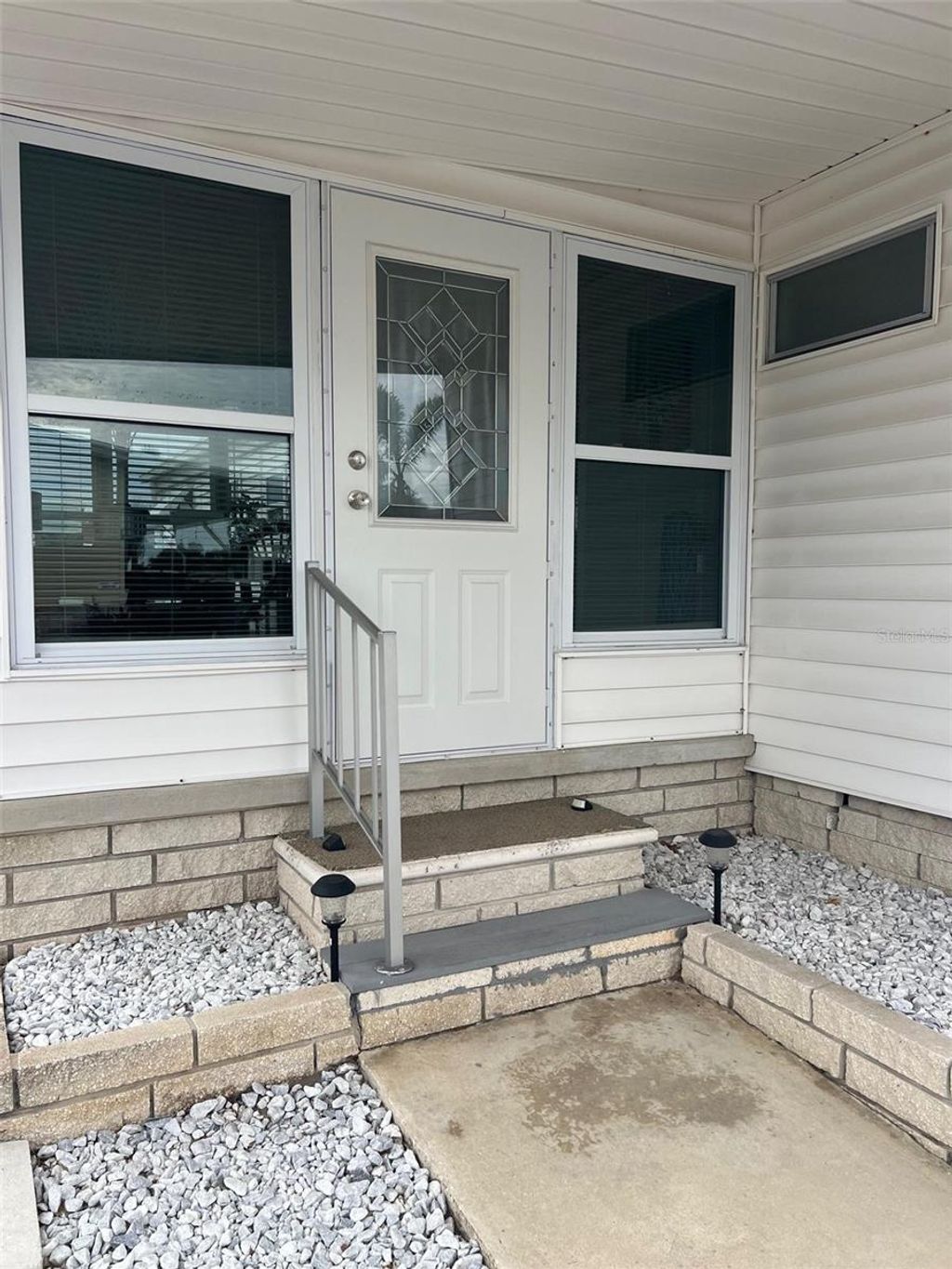 Photo of 44 Thatch Palm Street W, Largo, FL 33770 (MLS # TB8461259)