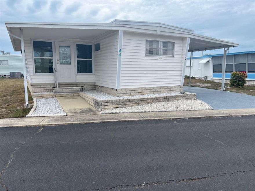 Palm Hill Country Club is a dynamic 55+ community brimming with activity and offering an array of amenities designed for leisure and enjoyment. Residents have access to a maintained golf course, sparkling pools, soothing jacuzzis, shuffleboard courts, horseshoe pits, and a well-equipped billiards room, among other facilities that foster a lively and social atmosphere. For just $554.00 per month, the maintenance fee provides comprehensive maintenance, including water, sewer, garbage collection, lawn care, cable, and high-speed Internet. This two-bedroom, one-and-a-half-bath home offers an excellent opportunity to enjoy a comfortable lifestyle in a community that encourages connection and relaxation.
INTERIOR:
Open one of the new exterior doors into this thoughtfully designed and fully furnished home, showcasing exquisite decor and a welcoming ambiance. The spacious open floor plan, complemented by a split-bedroom layout, ensures privacy for both owners and guests. The interiors feature a harmonious mix of laminate flooring, laminate tiles in the expansive lowered Florida room, and vinyl tiles in the bathrooms, blending durability with style. The new updated kitchen with a refrigerator, range oven, dishwasher, and microwave, is both functional and inviting. The sizable living area flows seamlessly into the generously proportioned open Florida room, offering additional living space enhanced by new windows installed in 2020. The first bedroom includes an updated half bath, while the second bedroom provides ample closet space and convenient access to a modernized bathroom with a walk-in shower, creating a comfortable and practical retreat for its occupants.
EXTERIOR:
The exterior of this home, featuring vinyl siding,  is a picture of meticulous upkeep, exuding charm and practicality at every turn. Equipped with central heating and air conditioning, it guarantees a comfortable indoor climate all year. A convenient shed houses a washer and dryer, adding to the functional appeal of the property. The sturdy roof-over design provides excellent coverage , while a designer driveway to the carport offers two designated parking spaces, making access to parking a breeze. Priced at $85,000 with a share included, this home presents an exceptional opportunity for those seeking a place to truly call their own in an appealing and high spirited community.