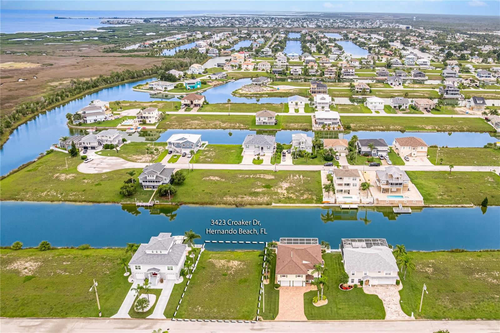 Build Your Dream Home in Coastal Paradise - Hernando Beach South
Discover the perfect opportunity to create your ideal waterfront lifestyle on this beautiful vacant lot located in sought-after Hernando Beach South. Enjoy indirect Gulf access via the private community boat lift near Companero Entra—offering you all the perks of Gulf living without the higher price tag.
This property is in flood zone AE, which means lower insurance premiums and building costs—a smart investment for anyone looking to enjoy affordable coastal living. Public utilities (electric, water, and sewer) are available nearby, making the build process even more convenient.
Hernando Beach is a quiet, welcoming community known for its charming local restaurants, live entertainment, and laid-back waterfront vibe. You're just minutes from the Weeki Wachee State Park, a public boat ramp, and a full-service marina. Whether you're into boating, scalloping, fishing, or simply soaking in the incredible Gulf sunsets, this is the place for you.
Located about an hour from Tampa International Airport, with low property owner association dues, this lot offers the perfect blend of tranquility, recreation, and accessibility. Don't miss this chance to build your dream home in one of Florida's hidden gems.