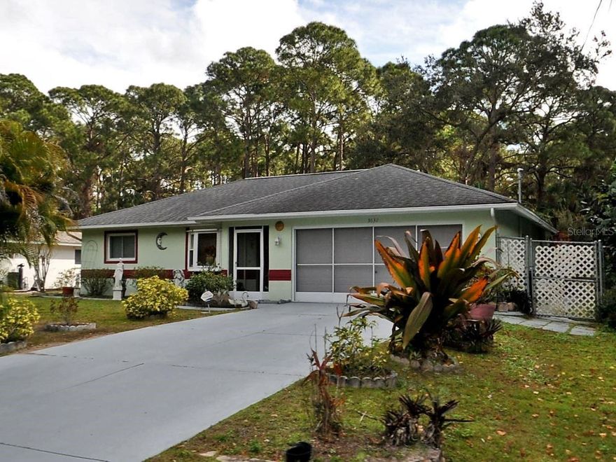 This 3 bedroom 2 bath 2 car garage is in a great location in beautiful North Port. Home is on city water and backs up to a large piece of acreage giving you plenty of privacy. Property is fenced in. Large enclosed lanai with tile flooring. Centrally located to EVERYTHING...US-41,   I-75, schools, Suncoast Technical College, Shannon Staub Library, and plenty of grocery & retail shopping, and dining. Close to Venice, Port Charlotte & Punta Gorda. Minutes to the North Port Aquatic Center, the water park that features a 25-meter stretch pool, three slides, and a lazy river.  Convenient access to a multitude of golf courses, world-class fishing, boating, and stunning Gulf beaches!