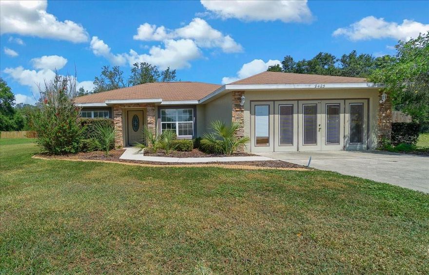 Endless potential in a prime location near The Villages! This three-bedroom, two-bathroom home with a bonus room offers versatility and opportunity, perfectly situated off a highly traveled road — ideal for visibility and accessibility. With the possibility of special zoning for office use, this property could serve as a comfortable residence, professional office, or small business location. The garage has been converted to provide additional living or workspace, giving you plenty of flexibility. Inside, enjoy easy-care tile and vinyl flooring throughout, and unwind on the screened-in back porch overlooking the private backyard. Conveniently located close to shopping, dining, medical facilities, and amenities, this property combines comfort, convenience, and commercial potential — a fantastic opportunity in one of the area’s most desirable growth corridors!