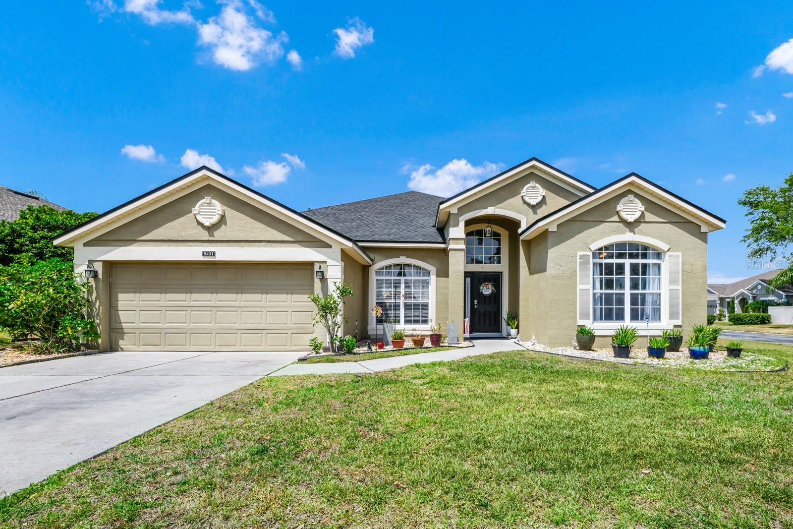 Don’t miss this stunning 4-bedroom, 2-bath home in a gated community, tucked away on an oversized corner lot—perfect for adding a pool! Fenced yard! This home is designed to impress, from the dramatic 14' ceilings in the formal areas to the spacious open-concept kitchen and family room. The primary suite offers a cozy sitting area, a walk-in closet, and a spa-inspired bath with a garden tub and walk-in shower. With laminate floors throughout the living areas. Step outside to your private fenced backyard. With a flexible floor plan and a fantastic location, this home truly has it all—comfort, elegance, and room to grow. Schedule your tour today and make it your home sweet home!