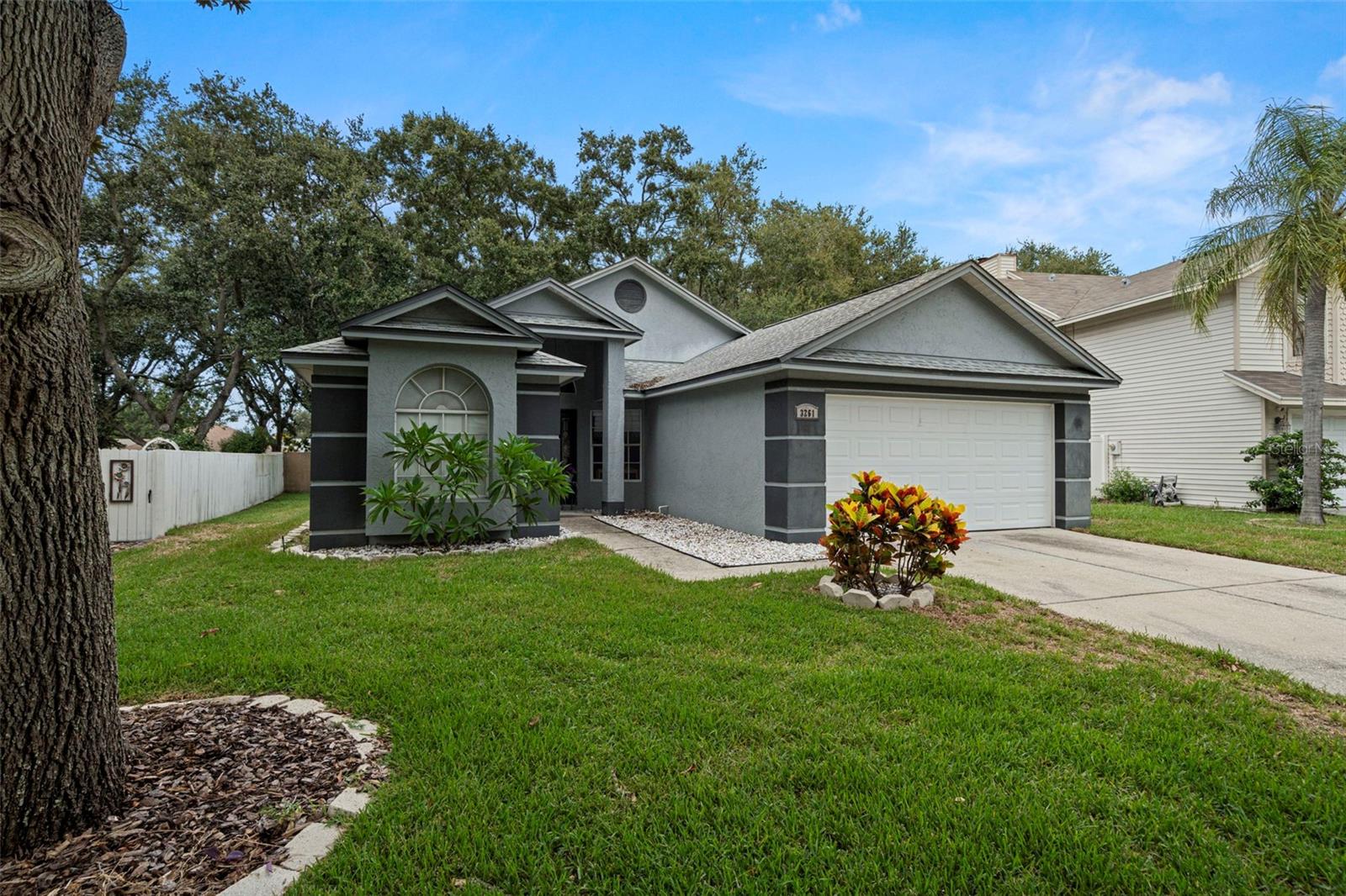 Located in the heart of Hamlet at Bentley Park, this charming home offers 3 bedrooms, 2 bathrooms, and 1,555 heated square feet of living space.
As you enter, you’ll immediately notice the vaulted ceilings and the welcoming flow of the floor plan. The spacious den and dining area seamlessly connect to the open-concept living room and eat-in kitchen, creating the perfect space for entertaining or everyday living. The updated kitchen features crisp white shaker cabinets and granite countertops, blending both style and functionality. Sliding doors off the living room lead to the covered back patio and backyard, ideal for outdoor gatherings.
The large primary suite includes a nicely updated bathroom with a white shaker vanity and granite countertop. Two additional generously sized bedrooms are thoughtfully positioned with a full bathroom in between, offering comfort and privacy for family or guests.
Additional highlights include a two-car garage and the home’s location within a highly sought-after school district.