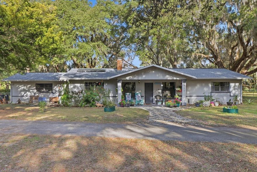 One or more photo(s) has been virtually staged. Welcome to this well-maintained 3-bedroom, 2-bath home with a 2-car garage, offering 1,932 square feet of living space. The layout includes a spacious 13 x 33 Florida room featuring a second fireplace, providing additional flexibility for everyday living or entertaining. Set on a 1.65-acre corner lot, the property is surrounded by mature oak trees and includes a chain-link fenced backyard. Recent updates include a roof replacement in 2021, HVAC replacement in 2021, a solar water heater installed in 2015, updated kitchen appliances, granite countertops, and updated bathrooms. Enjoy a country-style setting with frequent wildlife, while still being conveniently located near the town of Crystal River, known for fishing, boating, scalloping, and swimming with the manatees. Schedule your showing today!