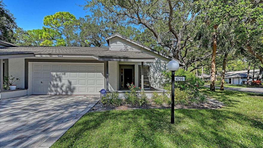 You will love Oak Forest with all the mature trees and grassy landscaped areas and its LOCATION!  Just minutes to Siesta Key Beaches, Downtown shopping, restaurants, social events and theater.  This community is impeccably maintained and modernized.  Recent updates include roofs, exterior painting and paver driveways.  The Association remains diligent regarding their finances and are fully reserved.   Conveniently located directly across from the community pool and tennis courts, the entire interior of this end unit was just painted and all of the popcorn has been removed.  The guest bathroom totally remodeled with a walk-in shower.  New never been used stainless steel appliances: refrigerator, stove and dishwasher are included.  AC was replaced in 2025.  Tile flooring throughout the villa with vinyl flooring for easy maintenance in the guest bedroom.  Primary bedroom has brand new carpet and offers two walk-in custom designed closets for maximum efficiency.  Primary bathroom designed with dual sinks and a walk-in shower with glass doors. The Primary Bedroom, Living Room and Kitchen have sliding glass doors to access the extended private lanai.  This community is not an age restricted community, is pet friendly and offers tennis, pickleball, heated pool and clubhouse.  Whether you are a snow bird or a full-time resident this property checks desired boxes for your new home.  No CDD fees!