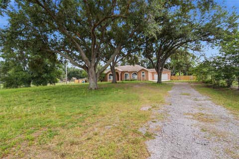 Photo of 6611 W Knights Griffin Road, Plant City, FL 33565 (MLS # TB8519676)