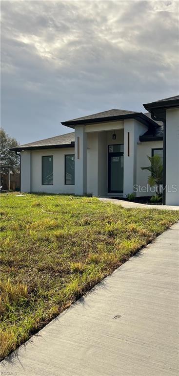 Welcome to an exceptional new construction residence in the heart of Lehigh Acres, where contemporary luxury meets thoughtful design. This impeccably crafted home presents an enticing blend of sophistication and practical living spaces, offering 3 bedrooms and two well-appointed bathrooms + Den. Step through the elegant double-door entry into a home that exemplifies modern Florida living. The great room design creates an impressive sense of openness, seamlessly connecting living spaces and establishing an ideal environment for both entertaining and daily life. The heart of this home is its beautifully conceived kitchen, featuring a traditional eat-in design enhanced by a generous island that doubles as a casual dining space. Culinary enthusiasts will appreciate the complete suite of new stainless steel appliances, including a refrigerator, dishwasher, microwave, and range. The kitchen's sophisticated aesthetic is elevated by premium granite countertops, which extend into the bathrooms, maintaining a cohesive design throughout. The primary bedroom suite stands as a private retreat, boasting a spacious walk-in closet and an elegant bathroom with dual sinks. Two additional bedrooms offer comfortable accommodations for family members or guests, while the second full bathroom ensures convenience for all. Throughout the residence, premium porcelain tile flooring creates a seamless flow, reflecting light and contributing to the home's bright, airy atmosphere. Safety and durability were paramount in the design, with impact windows and doors providing peace of mind during Florida's seasonal weather. The covered lanai extends the living space outdoors, offering a serene setting for morning coffee or evening relaxation. Professional landscaping enhances the front yard, creating immediate curb appeal and a welcoming approach to your new home. The neighborhood boasts exceptional educational opportunities, with elementary, middle, and high schools mere moments away, along with a public library for lifelong learning. Daily conveniences are equally accessible, with shopping and dining options within easy reach. For the practically minded, it's worth noting that this property sits outside designated flood zones, offering additional peace of mind. This new construction represents more than just a house; it's an opportunity to embrace a lifestyle where comfort meets convenience, where modern amenities blend seamlessly with practical living, and where every detail has been carefully considered to create an exceptional living experience. Don't let this remarkable opportunity pass you by - schedule your private showing today and step into your future home.
FL-82
Lehigh Acres, FL 33974
Head northwest on FL-82 W toward Alabama Rd S
?
0.3 mi
Turn right at the 1st cross street onto Alabama Rd S
?
1.0 mi
Turn right onto Pelham Rd
?
0.2 mi
Turn left onto Partridge St
? Destination will be on the left
?
0.2 mi
155 Partridge St
Lehigh Acres, FL 33974