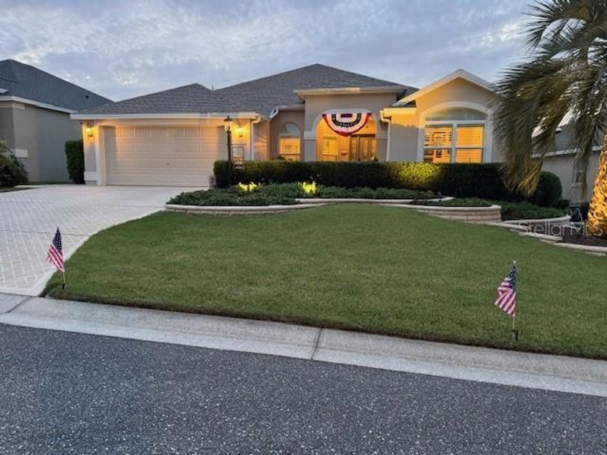 Come live the lifestyle in this beautiful 3 bedroom 2 bath Gardenia model located in one of the best neighborhoods in The Villages.  This 1927 sq ft home is stunning and well cared for with a private pool and outdoor kitchen and is located in the much sought after Village of Bonita. It is also centrally located between the sixes and minutes from the very popular Lake Sumter Landing. New roof in March 2025 and furnace and AC are approx. 5 yrs. old.  Step into style as you enter the home though the inviting entry way into this beautiful open floor plan that features chair rail moulding and the Wow factor view of the waterfall pool outside. The master suite is very spacious with walk in closets, dual vanities and a roman style walk in shower. The guest bedrooms are conveniently located next to the beautifully remodeled guest bathroom. Bedroom 2 features a beautiful Murphy bed with shelving and a marble top work station to complete the dual purpose office/bedroom. The kitchen features gorgeous cabinetry, gas range, solid surface and stainless steel appliances. The formal dining room is elegant with room for an 8 person table and the spacious and well thought out family room is perfect to entertain in. This home features a full size laundry room with cabinetry and a sink. The garage is roomy and features custom cabinetry and is air conditioned with a portable unit. You will spend a lot of time in your new backyard paradise featuring this sparkling pool with waterfalls, a beautiful outdoor kitchen perfect for entertaining, A full sized dining area with a tv and electric drop down shades. There are plenty of spaces on the patio for sunbathing or stargazing.  Lake Sumter Landing with Restaurants, shopping, and live entertainment are just minutes away by golf cart. You are in the sweet spot with Championship golf Including the premier Arnold Palmer 27 hole golf course and amazing Rec Centers and shopping centers just minutes away. The home is stylish and the location is ideal. Don't miss your opportunity to own this Private Paradise.