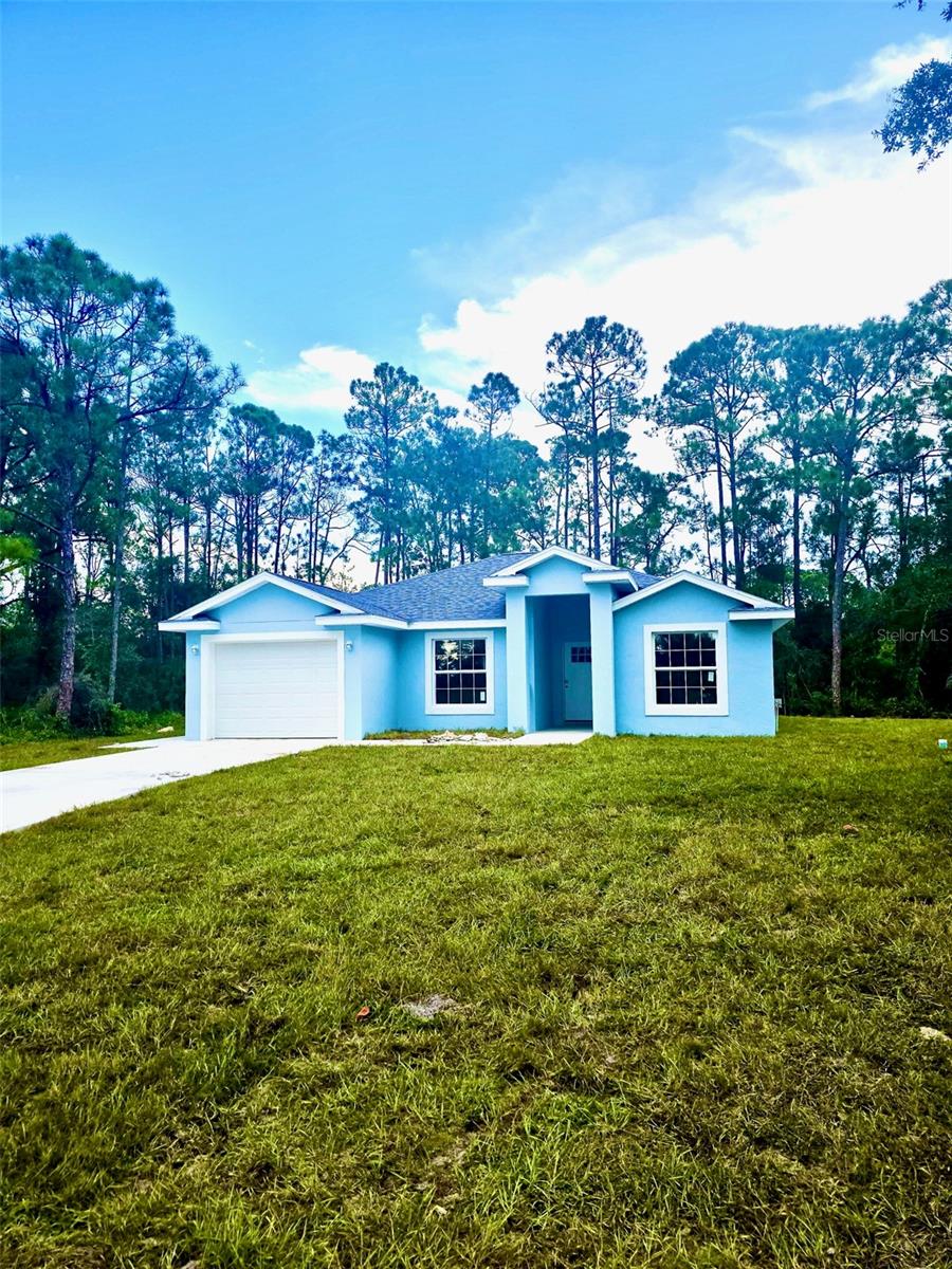 Charming 3-Bedroom, 2-Bath New Construction Home, located in the beautiful community of Placid Lakes. Welcome to this stunning newly built home, perfectly blending modern design with everyday comfort. From the moment you arrive, you’ll be greeted by a fresh light-blue exterior and a spacious driveway leading to your attached garage. Step inside to discover an inviting open layout filled with natural light. The home features luxury vinyl plank flooring throughout the living spaces, sleek ceiling fans throughout the home, also including central air and heat. A freshly modern home ready for your personal touch. The kitchen is a chef’s delight, showcasing stainless steel appliances, granite countertops, and shaker cabinets that provide both style and ample storage. The bathrooms continue the elegant theme with granite vanities, modern fixtures, and floor-to-ceiling marble-style tile in the showers for a spa-like feel. With three generously sized bedrooms and two full baths, this home offers plenty of room for family and guests. The master suite includes a private en-suite bath, spacious walk-in closet, while the two additional bedrooms share a beautifully appointed bathroom. Nestled on a quiet 1/4 acre lot surrounded by trees, with canal on the rear, this property offers a serene and safe atmosphere while still being conveniently located near by Lakes, churches, schools, shopping centers, dining, major roadways and world class fishing. Features You’ll Love:3 spacious bedrooms, 2 full bathrooms, Open-concept layout with modern finishes, Stainless steel appliances & granite counters, Stylish bathrooms with marble-style tile, Attached garage & large driveway, Freshly built, move-in ready. Don’t miss the opportunity to make this beautiful new home yours!