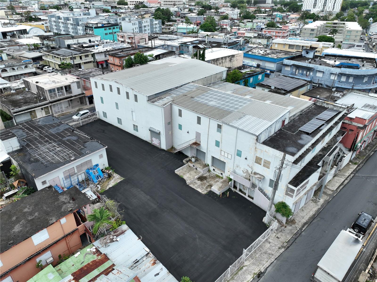 Unbeatable Opportunity in Caguas, PR! Invest in Your Next Big Success.
Are you looking for a property that can transform your business vision into reality or generate exceptional income flow? Presenting a mixed-use commercial real estate gem, strategically located in Caguas, PR, designed to maximize your business potential.
This impressive 2,350 m² lot hosts two solid concrete structures with steel roofs. It’s not just a space; it’s a platform for growth and versatility.
The main two-story building boasts a massive warehouse of approximately 25,730 sqft with ceiling heights ranging from 12 to 23 feet. With three loading docks, your distribution operations will be seamless and efficient.
Adjacent to the main building, you’ll find four additional units, each measuring about 600 Sqft, each with private access. Perfect for offices, showrooms, or individual rentals, they’re ready to generate income immediately!
The property also includes a second standalone building of approximately 2,356 sqft, and its CUT-8 zoning unlocks a world of possibilities.
Strategically located at coordinates 18.2298456, -66.0330281, your business will enjoy unbeatable accessibility to major thoroughfares.
The property offers a spacious parking area, ensuring convenience for both clients and employees.
This property provides a home for your business or investment. Don’t miss the opportunity to acquire an asset that not only meets but exceeds expectations.