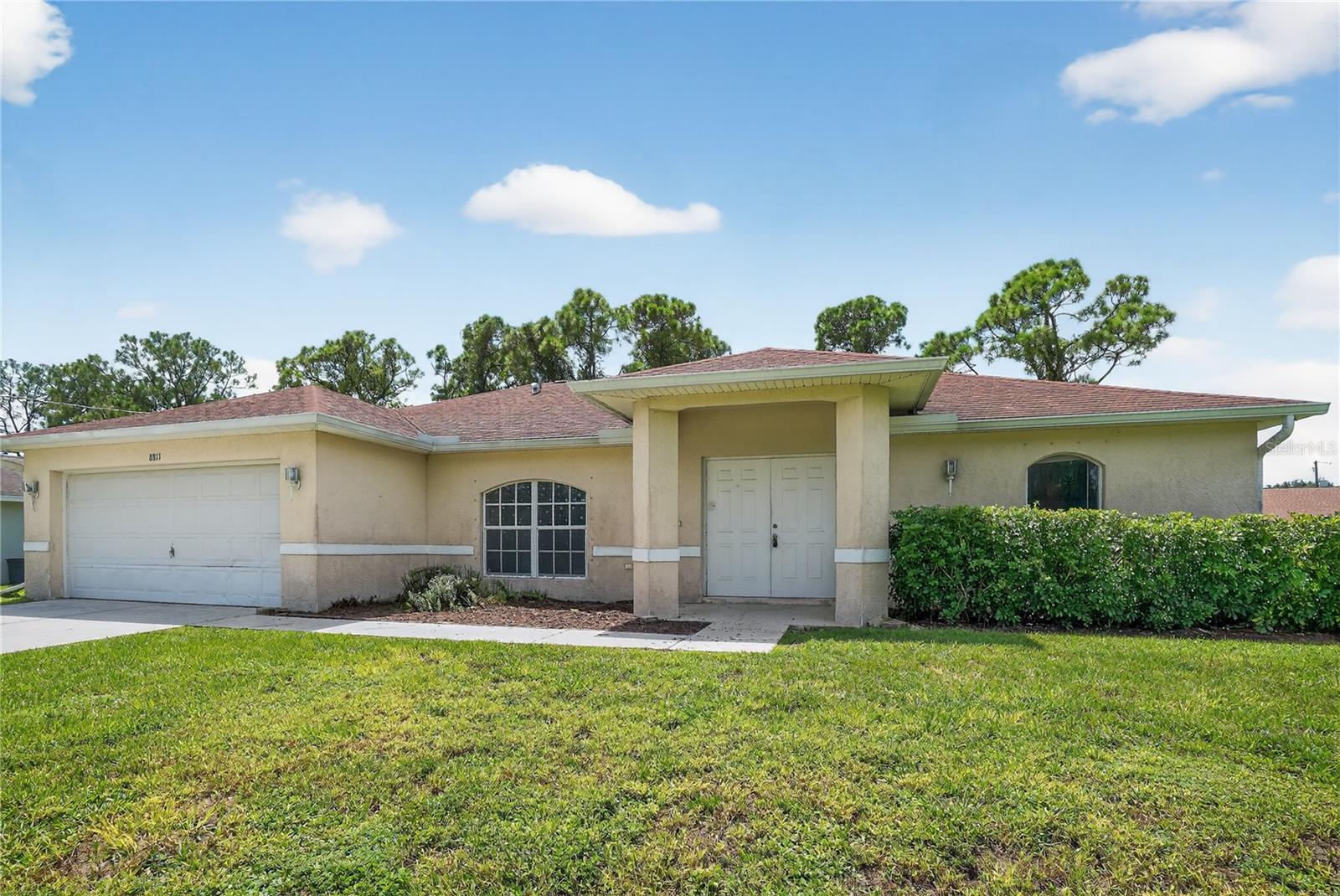 Conveniently located between Fort Myers and Lehigh acres, you'll find this charming home with a sunny disposition. Vaulted ceilings give a grand appeal to the open living area with plenty of options for living room and dining room lay out. The kitchen is a dream with exceptional counter space, loads of cabinetry, tile backsplash and exceptional breakfast bar area. The owners suite is a showstopper with an exceptional en suite bath with garden tub and separate shower along with His and Hers sinks and spacious sleeping area. From the living room, French doors lead to the office with built-in shelves perfect for all your favorite books or maybe you prefer a den space or movie room. You'll also find a private, 2nd full bath along with 2 spacious bedrooms with ample closet space. The 2 stall garage is perfect for vehicles, yard tools, water toys or bikes. Across the street you'll find Buckingham Trails Preserve with 572 acres of nature to explore and over 7 miles of hiking trails. Imagine spending your day in the woods then coming home to your glistening pool where you can cool off with a quick swim in the refreshing water. You could end your day grilling on the paver patio and watching the stars light up the night sky. Ready for your final touches, build your equity, Welcome home!