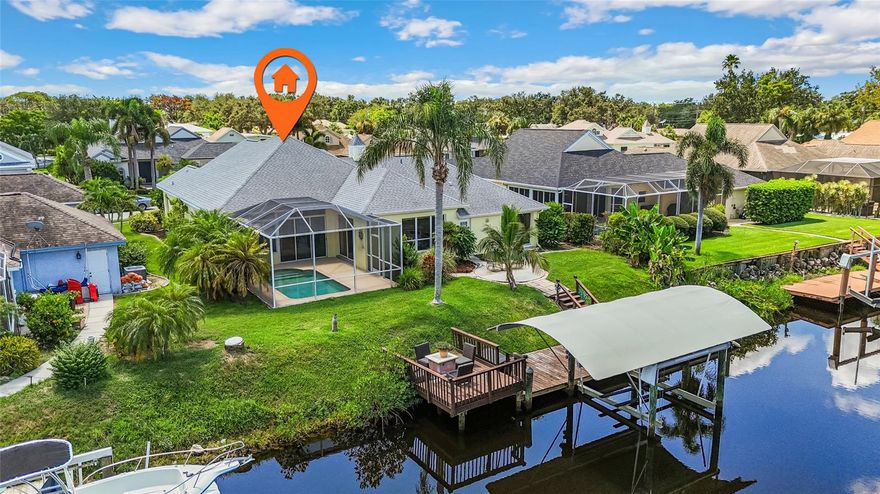 One or more photo(s) has been virtually staged. Motivated sellers! Best-priced waterfront pool home in The Inlets. Original condition—ready for your designer touch! Direct Gulf access from your covered 12,000-lb lift—minutes to the Manatee River, ICW, and Gulf. Classic Key West–style 4BR/3BA, ~2,456 sf with pool, AC’d Florida room, and flexible split plan. Low HOA (~$100.50/mo) and NO CDD in coveted The Inlets. Experience the pinnacle of Florida waterfront living in this elegant Classic Key West style 4BR/3BA, 2,456 sq. ft. residence in the coveted boating community of The Inlets. Designed for the discerning water enthusiast, the high-performance extended-cover dock with 12,000-lb aluminum lift accommodates large vessels with ease, offering direct, swift access to the Manatee River, Intracoastal Waterway, and Gulf of Mexico. Your private saltwater canal setting invites endless days of luxury fish from your dock, embark on a sunset cruise, paddleboard, kayak, or simply unwind beside the sparkling pool. Two-tiered decks and lush tropical surroundings create an entertainer's paradise for alfresco dining and sun-soaked relaxation. Inside, a flexible floor plan allows for an in-law suite or private office, while expansive sliding glass doors and an air-conditioned Florida room seamlessly merge indoor and outdoor living. Recent enhancements include a high-efficiency HVAC, gas water heater, and upgraded garage door. Residents of The Inlets enjoy exclusive access to tennis courts, a playground, and a picturesque waterfront park. With low HOA, no CDD, and an unbeatable location minutes from I-75, world-class beaches, fine dining, and three major airports, this is your opportunity to drop anchor and indulge in the nautical lifestyle you've always dreamed of.