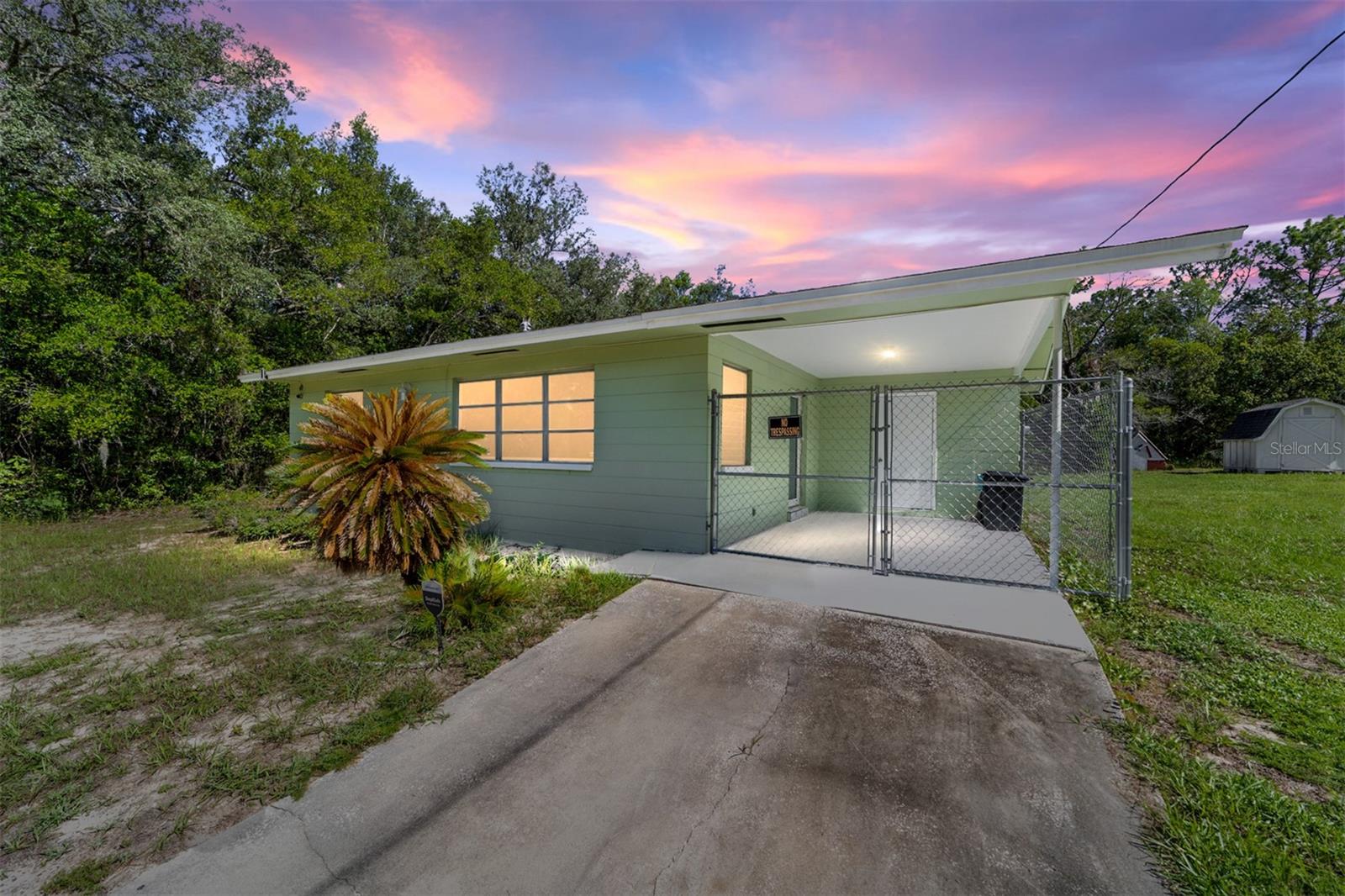 A charming two-bedroom, one-bath home at 22507 SW Beach Boulevard, Dunnellon, Florida, 34431, with 768 feet of living space and 1156 feet under roof. Perfect as a starter or winter getaway, for peace of mind, it features a 2022 water heater, 2023 roof, 2023 electric panel, 2021 AC, and all appliances, including washer and dryer. It has a six-foot privacy vinyl fence for a dog run, a secure fenced-in carport, and a separate laundry room. Just minutes from Rainbow River for kayaking, tubing, and canoeing. It’s close to Dunnellon’s shops and restaurants, and only twenty minutes from the World Equestrian Center, all for 174,900. Rainbow Lakes Estates has a nice facility for families with a lake for fishing as well as a community center that can be rented for parties. Schedule your showing today!
