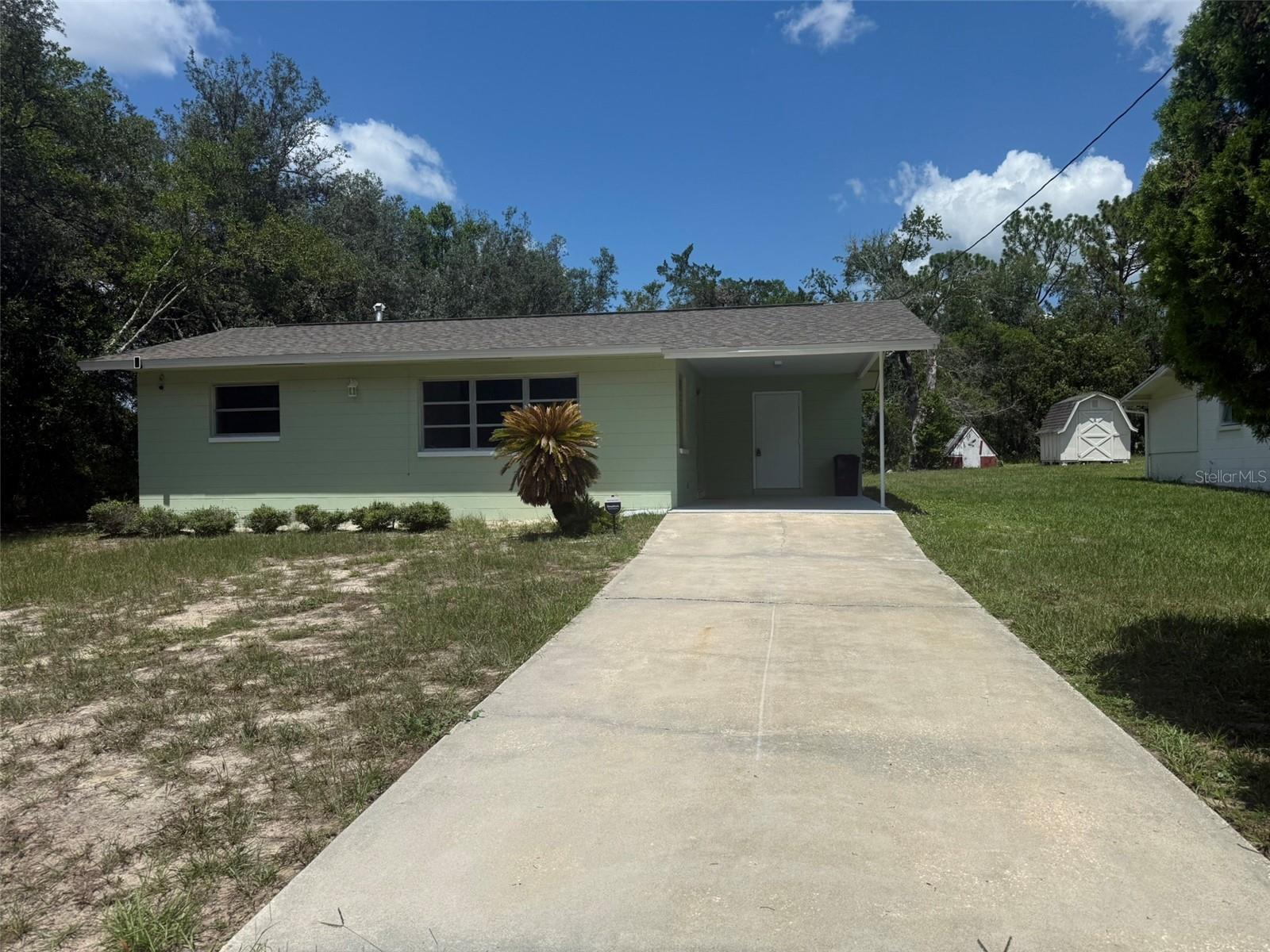 Huge Price Improvement! Now's your chance to own a charming two-bedroom, one-bath home at 22507 SW Beach Boulevard, Dunnellon, Florida, 34431, with 768 feet of living space and 1156 feet under roof. Perfect as a starter or winter getaway, for peace of mind, it features a 2022 water heater, 2023 roof, 2023 electric panel, 2021 AC, and all appliances, including washer and dryer. It has a six-foot privacy vinyl fence for a dog run outside of the patio and a separate laundry room. SW Beach Blvd is a great location with new construction in the area. The street will take you straight to the Community Center, the lake for fishing and outdoor activities. Just minutes from Rainbow River for kayaking, tubing, and canoeing. It’s close to Dunnellon’s shops and restaurants, and only twenty minutes from the World Equestrian Center. Rainbow Lakes Estates has a nice facility for families with a lake for fishing as well as a community center that can be rented for parties. Schedule your showing today!