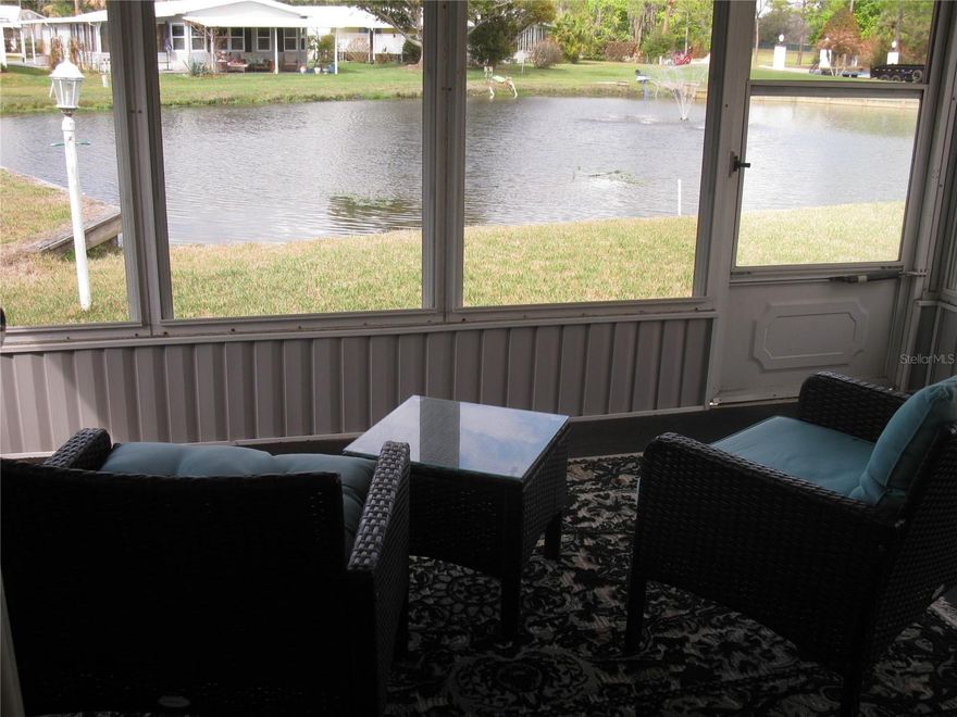 This cute waterfront, Golf Course view home is in move in ready.   Priced to sell for the location and condition, Turnkey.  2 bdrm 2 bath in a gated gold and tennis community, with many amenities.  enjoy 18-hole executive course, tennis court, pickle ball court, marina with boating and fishing pier on Lake Henry, heated pool, fitness center, A big, beautiful clubhouse with ballroom, craft room, library, billiards, and a full service Pub with lots of activities, shows, and entertainment.  You will love Sweetwater, the best kept secret in Central Florida.  and very reasonable.  Our HOA fee of 387.00 includes your water, sewer, trash pickup 2xwk, full Cable TV, high speed internet and Golf!!  a 5.00 trail fee  is all golfers pay.   Call to take a tour of our community and see if there's a forever home for you available.