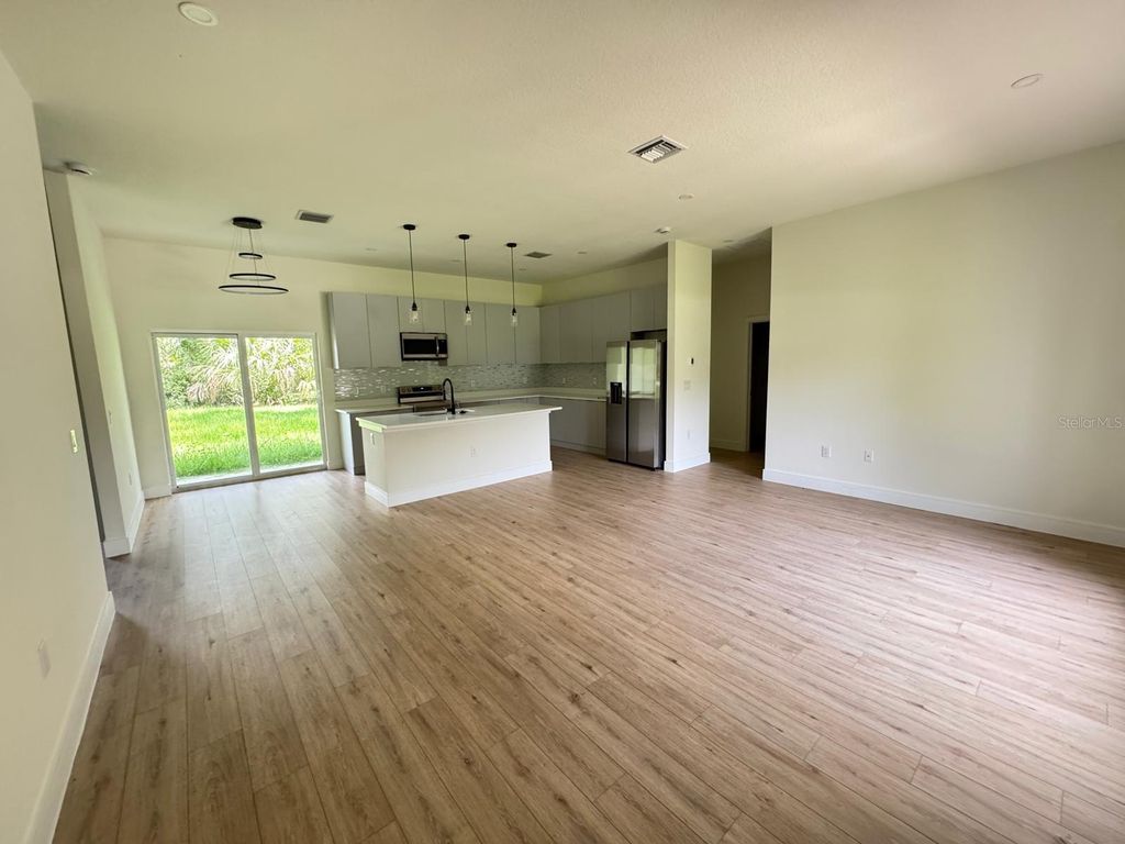 Photo of 353 Warrington Boulevard, Port Charlotte, FL 33954 (MLS # O6312860)