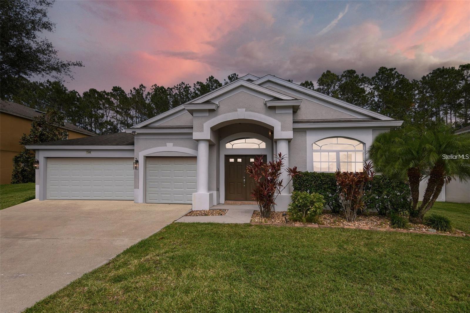 This home features 4 bedrooms 3 bathrooms, and a 3-car garage. It is located in the community of Palm Cove, situated on a peaceful conservation lot spanning almost a quarter acre, ensuring no backyard neighbors. With over 2,760 square feet of elegant and comfortable living space, this home is freshly cleaned and ready for immediate occupancy. The brand-new AC was installed in December 2022. The soaring ceilings and ample bright windows allow abundant natural light to fill the home. Spacious and private Living, Dining, and Great rooms provide a cozy yet secluded ambiance. Updated kitchen with Granite countertop and stainless steel appliances. Newly painted, Water proof luxury vinyl flooring.The open kitchen offers a perfect setting for entertaining your family and guests, with views extending into the Dining Room and Great Room. The large utility room comes equipped with a washer and dryer. The open-split floor plan ensures separation and privacy between the main suite and the other bedrooms in the house. Palm Cove community amenities include a pool, cabana, playgrounds, and Dog Parks. Conveniently located just minutes away from Epperson's Crystal Lagoon, highly rated schools, Pasco County Sports District Park, The Shops at Wiregrass, Florida Hospital, PHSC, Center Ice, Tampa Premium Outlets, and I-75 & I-275 with a convenient Overpass Rd exit. Nearby, you'll find a Publix, Starbucks, and several local restaurants, with expected new openings in the near