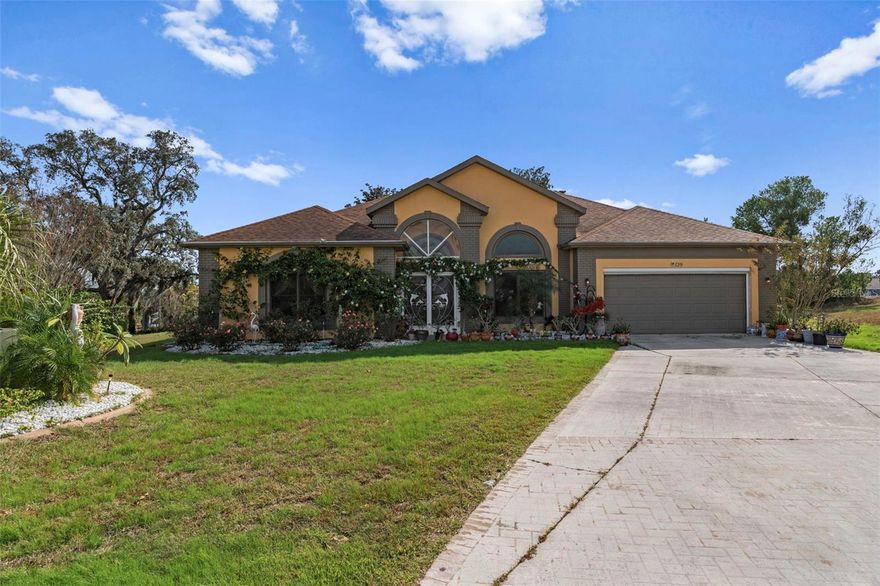 Welcome home to this spacious 4-bedroom, 2-bath beauty tucked inside a desirable gated community in Lecanto! With 2,697 sq ft of well-designed living space and a 2-car garage, this home offers tile flooring throughout and a versatile layout featuring both a formal living room and a comfortable family room—ideal for everyday living or entertaining.

A separate dining area creates the perfect spot for hosting holidays and special dinners, while the kitchen includes a cozy breakfast nook for casual meals and morning coffee. The split-bedroom plan provides privacy, with two of the three guest bedrooms featuring walk-in closets. The primary suite is a true retreat with double walk-in closets and a spa-like bath complete with a garden tub and separate shower.

Sliding glass doors open to a tiled porch, seamlessly extending your living space outdoors and leading to your private backyard oasis. Enjoy Florida living at its best with an in-ground pool featuring a new enclosure, surrounded by elegant travertine pavers that give the space a resort-style feel. For added convenience, there’s a bathroom entrance directly from the pool area—perfect for easy indoor-outdoor living and entertaining.

Updates & Peace of Mind: The home includes a newer roof (2017) and HVAC system (2017), helping keep maintenance costs low and comfort high for years to come.

Set within a secure, gated neighborhood, residents enjoy a private community setting with a well-kept atmosphere and the comfort of controlled access. Conveniently located near shopping, dining, and outdoor recreation, this home checks all the boxes for Florida living. Don’t miss your chance to make 129 N Skyflower Pt your own—schedule your private showing today!