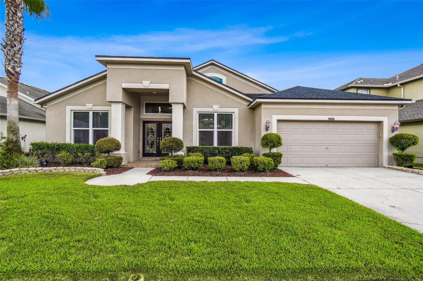 MOVE-IN ready Lake Front 4 bedroom, 3 bath home is located in the beautiful, gated community of Ivy Lake Estates and boasts over 2,600 sq ft of living space. Architectural features include: high ceilings, bright open spaces where natural light flows through, Travertine stone floors from Italy located in all wet areas and hallways. Den, Dining Room & Master Bedroom have Autumn Hickory wood floors. The oversized kitchen features newer stainless-steel appliances, Corian countertops, Maple raised panel cabinets and ample cabinet/counter space that opens to the large family room. A true Split floor plan w/oversized primary bedroom, bathroom with dual vanities, dual walk-in closets, garden tub, separate stand-alone shower w/sliding glass doors leading out to the lanai. The other side of the home has 3 bedrooms; 2 bathrooms and a laundry room w/built in cabinets for additional storage space, multi-room surround sound, built in ethernet in all rooms plus much more! The large, screened lanai has custom brick pavers w/gorgeous lake/nature views and no backyard neighbors which makes this home perfect for entertaining! UPGRADES: New Roof (2024), Tankless Hot Water Heater (2025), New High End Water Softener w/conditioner (2025), A/C (2021), Garage Door Engine (2021), Hurricane rated Windows (2018) including front/back glass doors and interior paint. This home has been meticulously maintained. Low HOA fees which include: Park, Playground, Sand Volleyball and Basketball Courts, Soccer Field and 24-7 Video Security Guard, Gated, No CDD and No flood insurance is required. Conveniently located near Veterans Expwy, Tampa Premium Outlet Mall, plus A rated schools and hospitals. Copy and paste to view professional walk thru video: https://realestate.febreframeworks.com/videos/0198a571-7925-707a-9ee1-0af1814e87ee