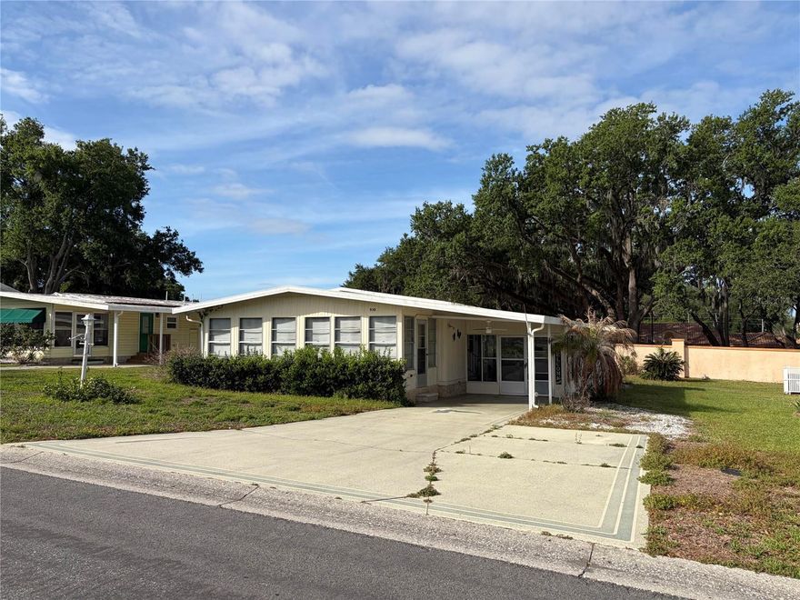 Enjoy the fun and convenience of The Villages lifestyle from this charming home in the historic district. Located in a quiet neighborhood just minutes from shopping, grocery stores, medical facilities, restaurants, and the lively town squares with nightly music and entertainment. Features include a spacious enclosed sunroom, large backyard, wide driveway, new AC, and newer refrigerator and stove/oven. Minimal furnishings make it easy to move right in and make it your own. Whether you're looking for a full-time home or seasonal retreat, this is a wonderful opportunity to enjoy the active, social Florida lifestyle The Villages is known for.