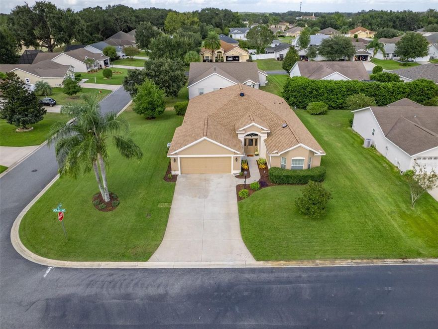 Welcome Home to this beautiful spacious corner lot house! Offering enough space for a pool that can be fenced in!
Location: The home is located in Bison Valley, which is an all-age community with access to The Villages, and the many amenities in Oxford, FL, including charter schools, medical facilities, banks, restaurants, shopping and many other resources, and entertainment options, makes it an even more appealing place to live. 
Size: The single-family home is approximately 2,517 Sq Ft under heat and AC.
Features: The house boasts 4 bedrooms, 2 baths, 2 car garage, an oversized lanai, 8'- and 10'-foot vaulted ceilings, elegant arched entryways, an oversized indoor laundry room (washer and dryer included) with built-in desk for an office, and extra cabinetry.
Kitchen: The kitchen is open-concept with recessed lighting, newer fan, and eat-in accommodations. It includes ample cabinetry and stainless-steel appliances.
Garage: There's a two-car garage with a golf cart included and the capability to charge an electric vehicle with a 50-amp outlet (excluding the plug).
Additional Features: The house features double-pane windows, two solar fans, an attic for additional storage, and elegant bamboo flooring, throughout most of the home including the master bedroom. The roof was recently replaced in 2022 and comes with a warranty and it is a mold resistant roof. The appliances are only 5 years old, while the washer and dryer are only 3 years old.
Master Bedroom and Bathroom: The master bedroom has a walk-in closet, and the master bathroom includes his and her vanities and a walk-in Roman-style tiled shower with a bench.
Curb Appeal: The home is situated on an oversized corner lot with beautiful landscaping. In this community you are allowed to put a fence on your back yard for your furry friend(s), pet friendly community.
Optional Furniture Package: There's an optional furniture package available, with a list provided upon request. 
Please enjoy the pictures and virtual slide show.  
Contact me today to schedule a personal showing or a custom virtual tour to experience the feel and look of this comfortable home here in Bison Valley.