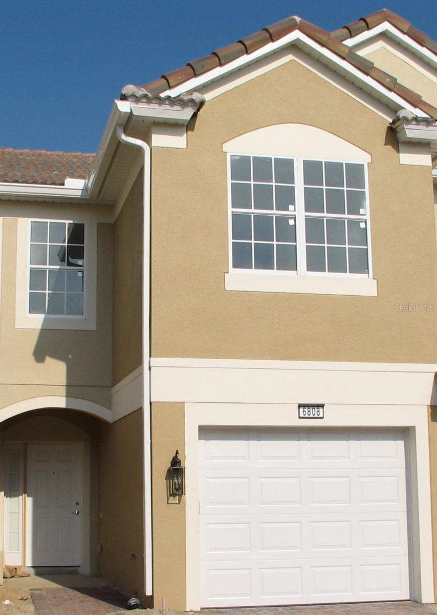 Welcome to this charming 3-bedroom, 2.5-bathroom townhouse nestled in the gated community of Phillips Commons. Enjoy the convenience of a community pool just steps away from your doorstep, perfect for relaxing or entertaining guests. Step outside onto your screened-in patio, ideal for enjoying the Florida weather year-round. Inside, new carpets adorn the stairs and bedrooms, providing both comfort and style. With the added bonus of a one-car garage, this townhouse offers both convenience and comfort in a sought-after community. The community is close to Universal Studios, I-4, Dr. Philips Elementary, and Sand Lake Road.