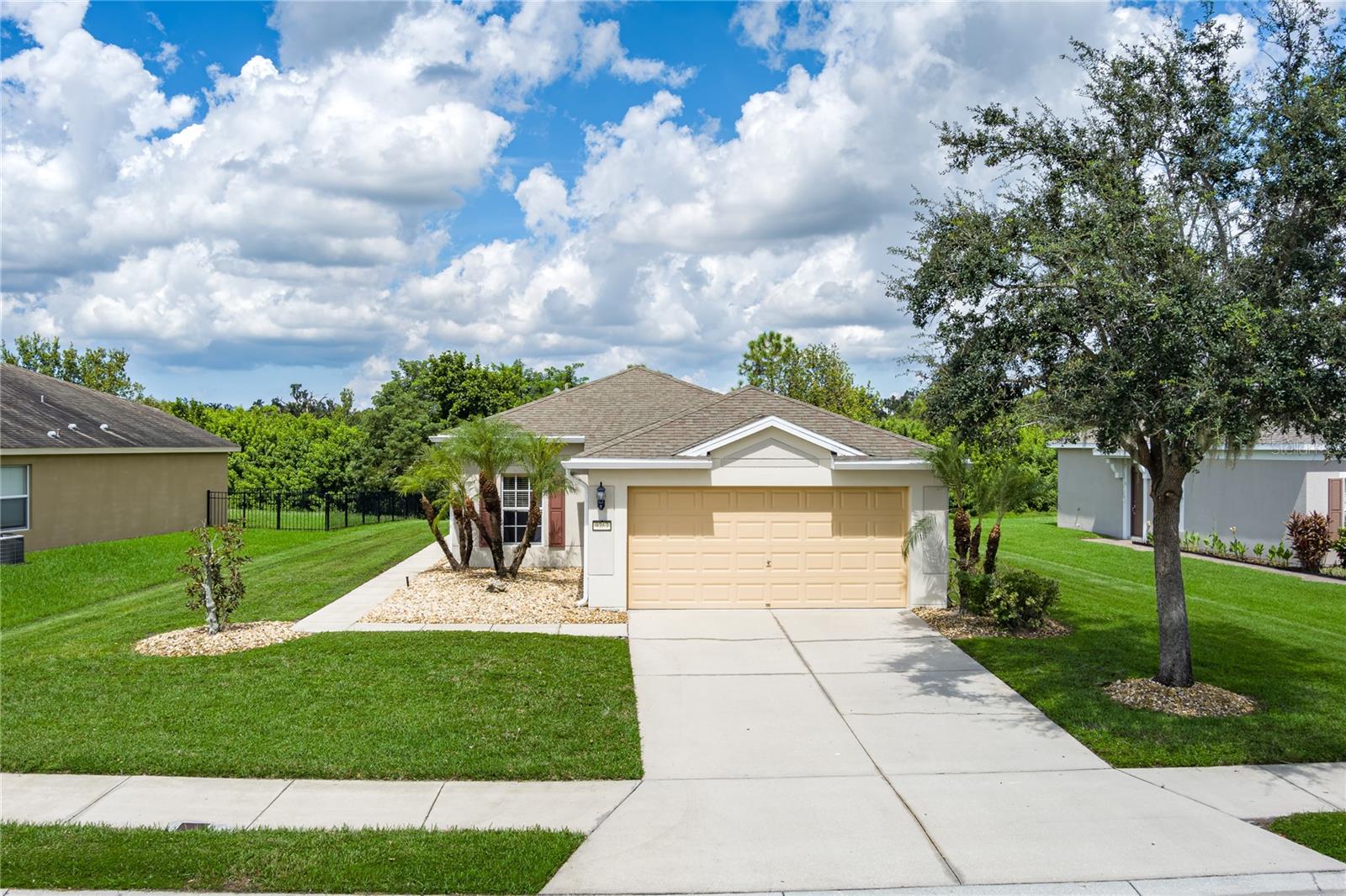 Located in the highly desirable community of Harrison Ranch, this 3 bedroom, 2 bathroom home offers an inviting open floor plan with a thoughtful split-bedroom layout that provides both privacy and functionality for everyday living. Tile flooring runs throughout the home, adding a clean, modern feel while making maintenance a breeze. The kitchen, dining, and living areas flow seamlessly together, creating a comfortable space for both entertaining and relaxing.
A highlight of the property is the large extended screened-in porch, the perfect place to enjoy peaceful preserve and pond views. With extra space between neighbors, you’ll also appreciate the sense of privacy this lot provides. Additional features include a convenient inside laundry room and a spacious yard with room to enjoy the outdoors.
Harrison Ranch offers resort-style amenities, including a community pool, fitness center, basketball courts, playgrounds, and miles of walking trails. The location is ideal, close to all the exciting new developments in Parrish as well as shopping, dining, and commuter routes. This home blends modern living with a fantastic community and location—truly a must-see.