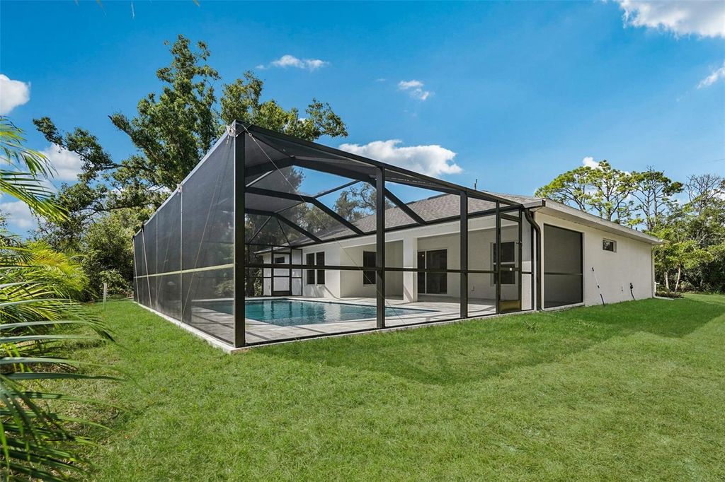 Photo of 16211 Chamberlain Boulevard, Port Charlotte, FL 33954 (MLS # C7516659)