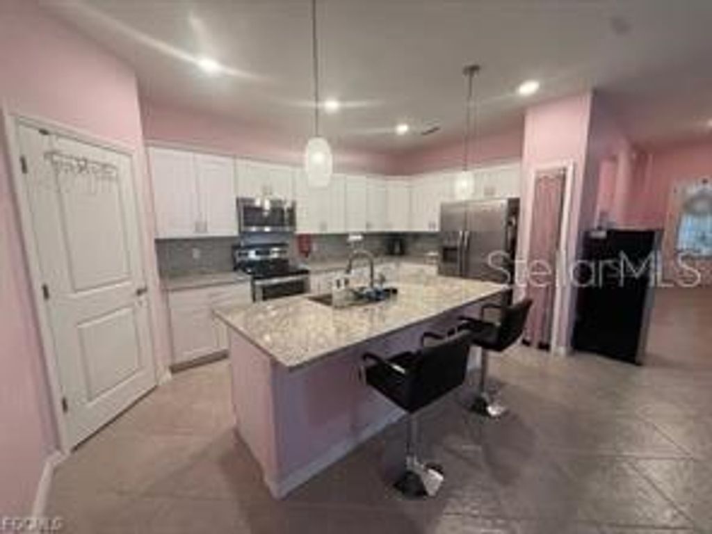 Photo of 1881 W Isles Road, Port Charlotte, FL 33953 (MLS # A4686780)