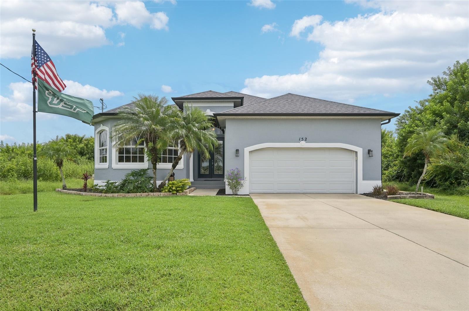 Welcome to Beach Days, Golf, and Your Best Life in Rotonda West! This home features three bedrooms, two bathrooms, and a sparkling heated saltwater pool. Beautifully updated and move-in ready, it invites you to start enjoying the easy Florida lifestyle you’ve been dreaming of. The curb appeal shines with a 2023 multi-dimensional roof, mature landscaping, striking architectural windows, elegant columns, and double leaded glass entry doors that create a welcoming first impression. Walk through the front doors and into a bright, airy foyer where tall ceilings, consistent wood look tile flooring throughout, and stylish columns make you feel right at home. The open great room layout brings everyone together, with a tray ceiling with crown molding that adds style, sliding glass doors that fill the space with light, and a kitchen and dining nook designed for easy conversations and family time. You will love cooking in the spacious kitchen, complete with gray shaker-style wood cabinets, quartz countertops, white tile backsplash, walk-in pantry, and a large center island with breakfast bar that blends modern style with everyday comfort. The adjoining nook offers easy access to the pool through a single French door, while a wall of bay-style windows and designer chandelier adds plenty of light. The ensuite master bedroom is a true retreat with sliding glass doors to the lanai, a tray ceiling with crown molding, and a spacious walk-in closet. The spa-like master bathroom features a large jacuzzi tub, double-sink quartz vanity, and walk-in shower, making both relaxation and daily routines effortless. The guest bedrooms are equally inviting with reach-in closets, while the guest bath includes a quartz-topped vanity and a tiled tub-shower combination. The interior laundry room has plenty of storage space with a built-in cabinet and shelving. Additional highlights include impact windows, plantation shutters on most windows, epoxy coated garage floor, and the tile flooring, countertops, baseboards, and appliances were all recently replaced. Life feels easy here on the partially covered, screened, and paver lanai where the 2022 added heated saltwater pool and spa is perfect for sunny afternoons in the water, evenings dining outside, and weekends spent with friends right at home. When you are ready to venture out, Rotonda West offers 5 golf courses, walking and biking trails, parks, and waterways for kayaking and fishing. Just minutes away you’ll also find Gulf beaches, tiki bars, world-class fishing, and plenty of local dining and shopping to enjoy. This home at 152 Spring Drive has everything you need to start living your best Florida life. Contact us today to schedule your private showing and see it in person.