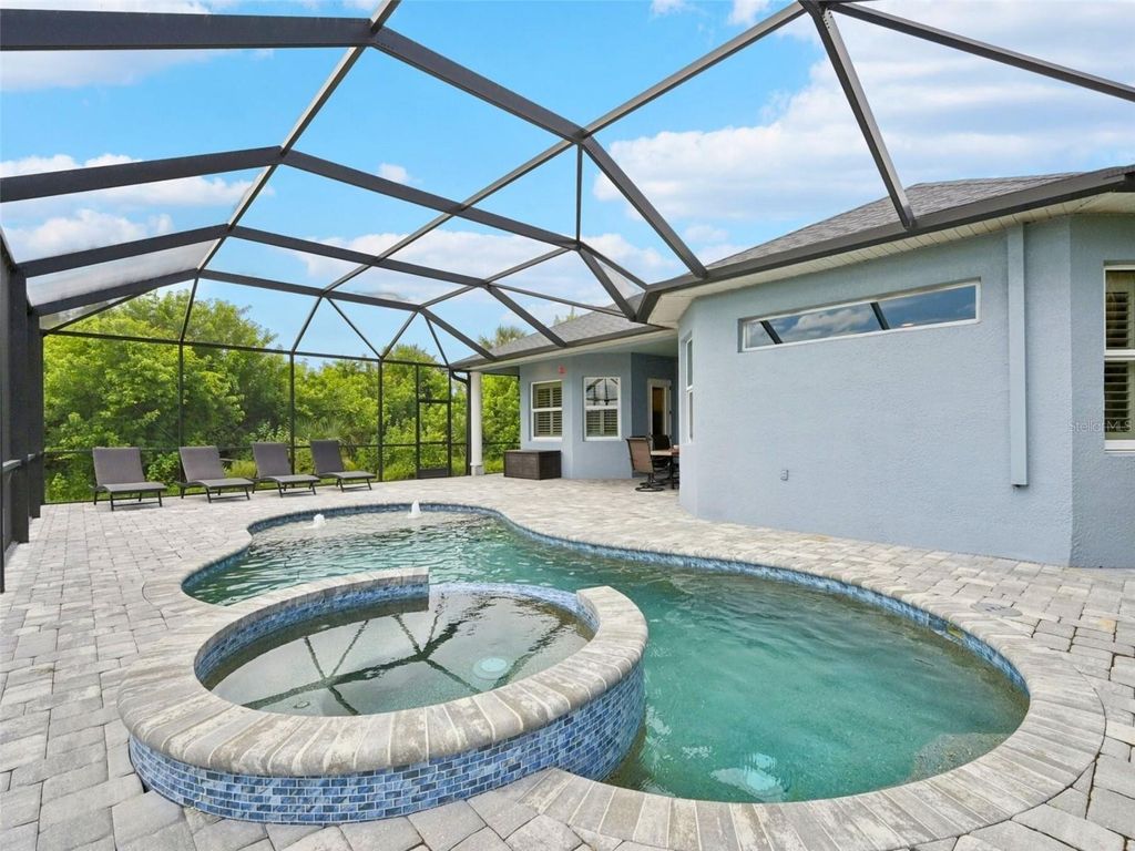 Photo of 152 Spring Drive, Rotonda West, FL 33947 (MLS # D6143753)
