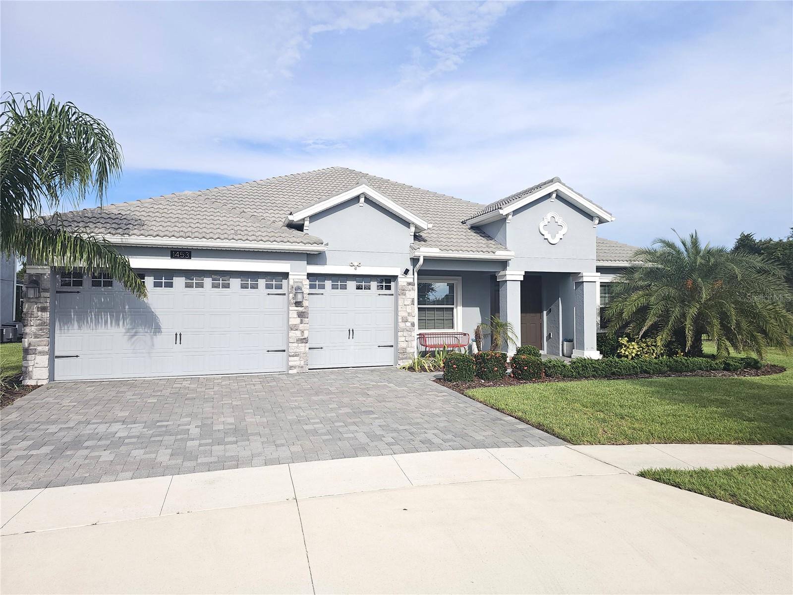 Welcome to your dream home in the Champions Gate Golf Country Club Community! This stunning Grande Charleston model offers 4 spacious bedrooms, 4 full bathrooms, and a large upstairs bonus room—ideal for a home theater, game room, or guest suite. Situated on a premium cul-de-sac lot, this home is thoughtfully designed for both comfort and luxury. The open-concept kitchen features 42” cabinetry, elegant quartz countertops, high-end stainless-steel appliances, and a breakfast nook that flows into a bright and expansive family room. Additional living spaces include a formal dining room, formal living room, a den, and a 3-car garage with golf cart-friendly access throughout the community. The lanai offers the perfect space for outdoor relaxation and entertaining. Live the resort lifestyle with access to world-class amenities including: Championship golf course, Oasis Club (14,000 sq. ft. clubhouse with restaurant, theater, lazy river, tiki bar, fitness center & more), The Plaza (second clubhouse with bar, restaurant, fitness center, game room, pickleball & pools), The Retreat Club with its own water park. The HOA includes golf and tennis memberships, access to all clubs, a $75/month food credit at The Plaza, lawn care, cable, high-speed internet, security monitoring, and more. Just 20 minutes from Disney, 25 minutes from Universal Studios, and 30 minutes from Orlando International Airport—this home offers luxurious living. Don’t miss your opportunity to own this impeccable Grande Charleston home in one of Central Florida’s most desirable gated communities. Schedule your showing today!