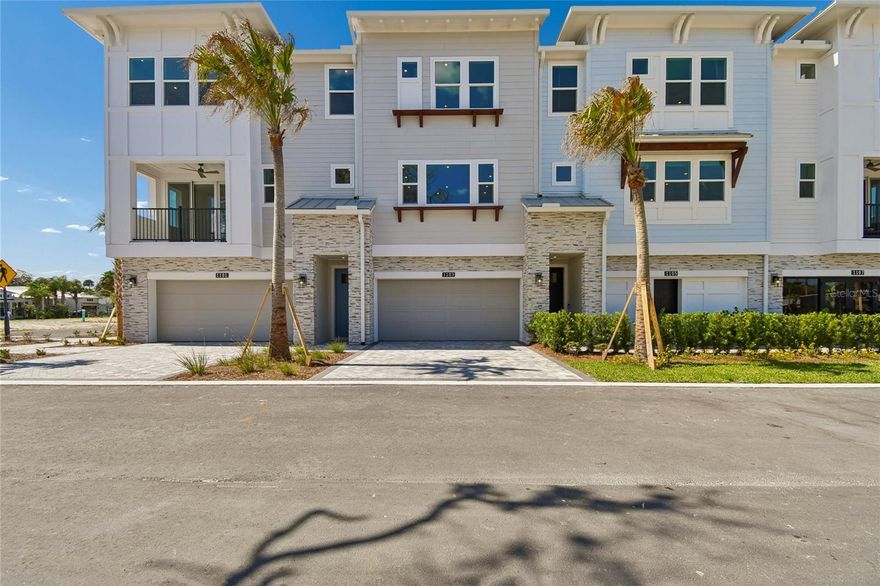 Under Construction. Under Construction. Images shown of model home. Brand New Beachside Living! This 3 story townhome captures the essence of effortless coastal living, just steps from the sands of New Smyrna Beach. From the moment you enter, you’re welcomed by a refined, light-filled interior where airy spaces, elevated ceilings, and expansive doorways create an unmistakable sense of openness. The kitchen is a cooks dream with its abundant cabinets and counter space as well as a walk in pantry.  Thoughtfully designed with flexible options to suit a variety of lifestyles, this home blends coastal charm with a polished, modern feel. This interior townhome offers incredible flexibility with first floor bedroom and lounge, giving opportunity for an office, an in-law suite or private guest quarters. It features a spacious two-bay garage with room for vehicles, paddleboards, and surfboards, plus a dedicated outlet ready for a golf cart or EV charger. Perfect for life by the beach. On the first floor, a versatile game room can easily convert into a fourth bedroom, home office, fitness space, or private guest retreat. The second level showcases an open-concept design where the great room flows seamlessly onto a private deck, creating the ideal indoor-outdoor setting for relaxing or entertaining. The gourmet kitchen is a standout, featuring a large center island and an expansive walk-in pantry for both everyday convenience and hosting. Upstairs, the third floor is anchored by a light-filled primary suite complete with a walk-in closet. Two additional bedrooms, an extra walk-in closet, and a centrally located laundry room provide comfort and functionality for daily living. Home still has time to personalize with your own design selections and colors. Schedule your appointment Today!