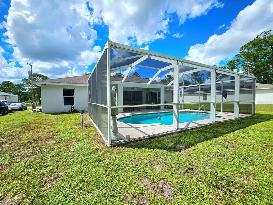 This fully renovated 3-bedroom, 2-bathroom home in central Lehigh Acres is move-in ready and designed for modern living. The kitchen features brand-new cabinets, countertops, and appliances, making meal prep a pleasure, while the bathrooms have been completely updated with new tile, stylish shower heads, and modern fixtures. Tile flooring flows throughout the home, complementing the bright, open layout with cathedral ceilings and a split-bedroom design for added privacy. Step outside to a private, screened-in pool and spacious lanai, perfect for entertaining or relaxing in the Florida sun. Additional upgrades include an epoxy-coated garage floor, wall-mounted pest tubes, and a roof approximately 9 years old, offering peace of mind. Situated on a quarter-acre lot in a convenient location, this home combines comfort, style, and functionality, creating a dream space that’s ready for you to enjoy from the moment you walk in.