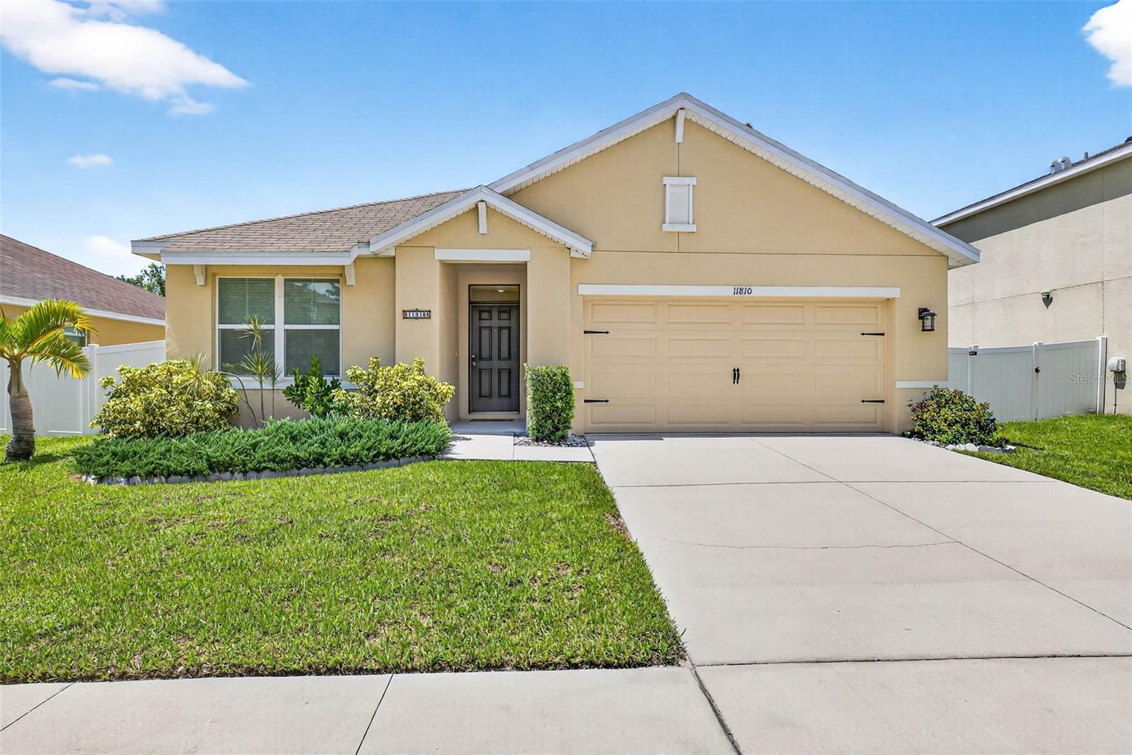 Welcome to this beautifully maintained 3-bedroom, 2-bathroom single-family home located in the highly desirable Park Creek community of Riverview. This thoughtfully designed residence combines modern finishes, functional living spaces, and resort-style community amenities.
From the moment you arrive, the curb appeal stands out with lush landscaping, a wide driveway, and a welcoming covered entry. Inside, the spacious foyer with arched entryways opens to an airy and inviting floor plan. The heart of the home is the open-concept kitchen, featuring granite countertops, a large island with bar seating, rich wood cabinetry, and modern black appliances. The kitchen flows seamlessly into the dining and living areas, perfect for entertaining or family gatherings.
The living room is bright and welcoming with large windows overlooking the backyard, while the dining space offers direct access to a screened-in patio—ideal for enjoying Florida evenings or weekend barbecues.
The owner’s suite provides a relaxing retreat with wood-look flooring, a walk-in closet, and a private en suite bathroom featuring dual vanities and a glass-enclosed shower. Two additional bedrooms offer flexible space for family, guests, or a home office/gym. A stylishly updated second bathroom with modern tile and a frameless glass shower door completes the interior.
Out back, the fully fenced yard offers both privacy and space for play or gardening.
Living in Park Creek means access to resort-style amenities, including a stunning community pool, playgrounds, and walking trails. The location is unbeatable—close to top-rated schools, shopping, dining, and major highways for an easy commute to Tampa, MacDill, Gulf Beaches, and surrounding areas.
This move-in ready home blends comfort, convenience, and community living. Don’t miss the chance to make it yours—schedule your private showing today!